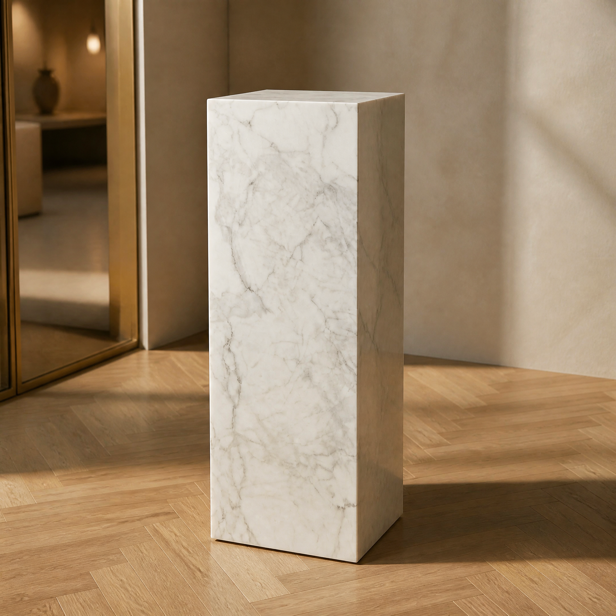 Macro closeup of the VORELLI White Carrara Marble Pedestal Stand highlighting the natural soft feathered light-grey veining and polished stone texture.