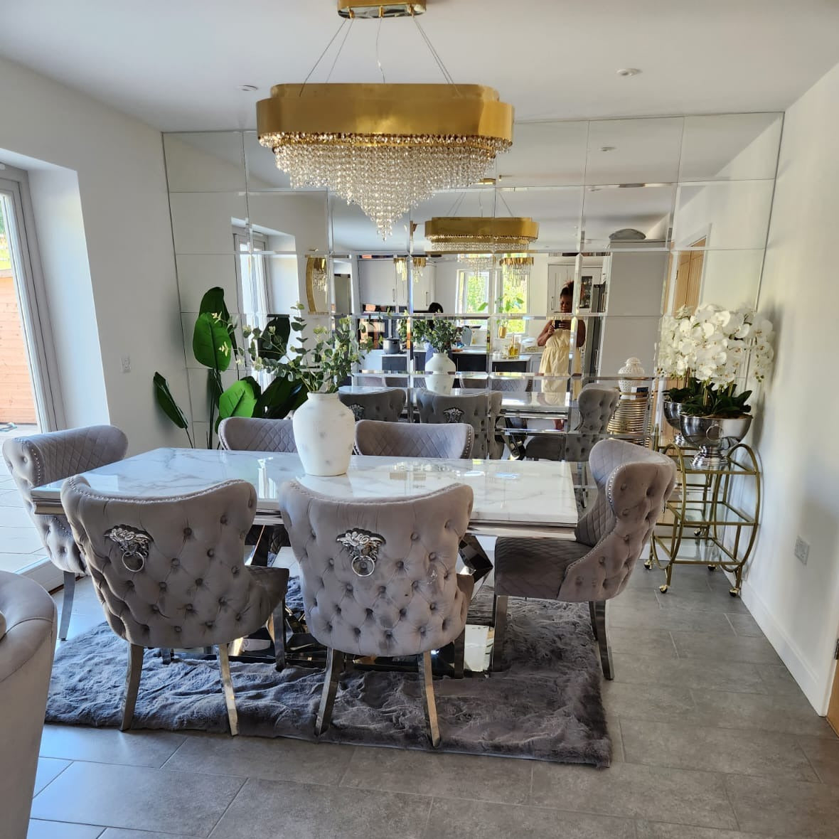 champs elysees rectangular chandelier installed in luxury dining interior