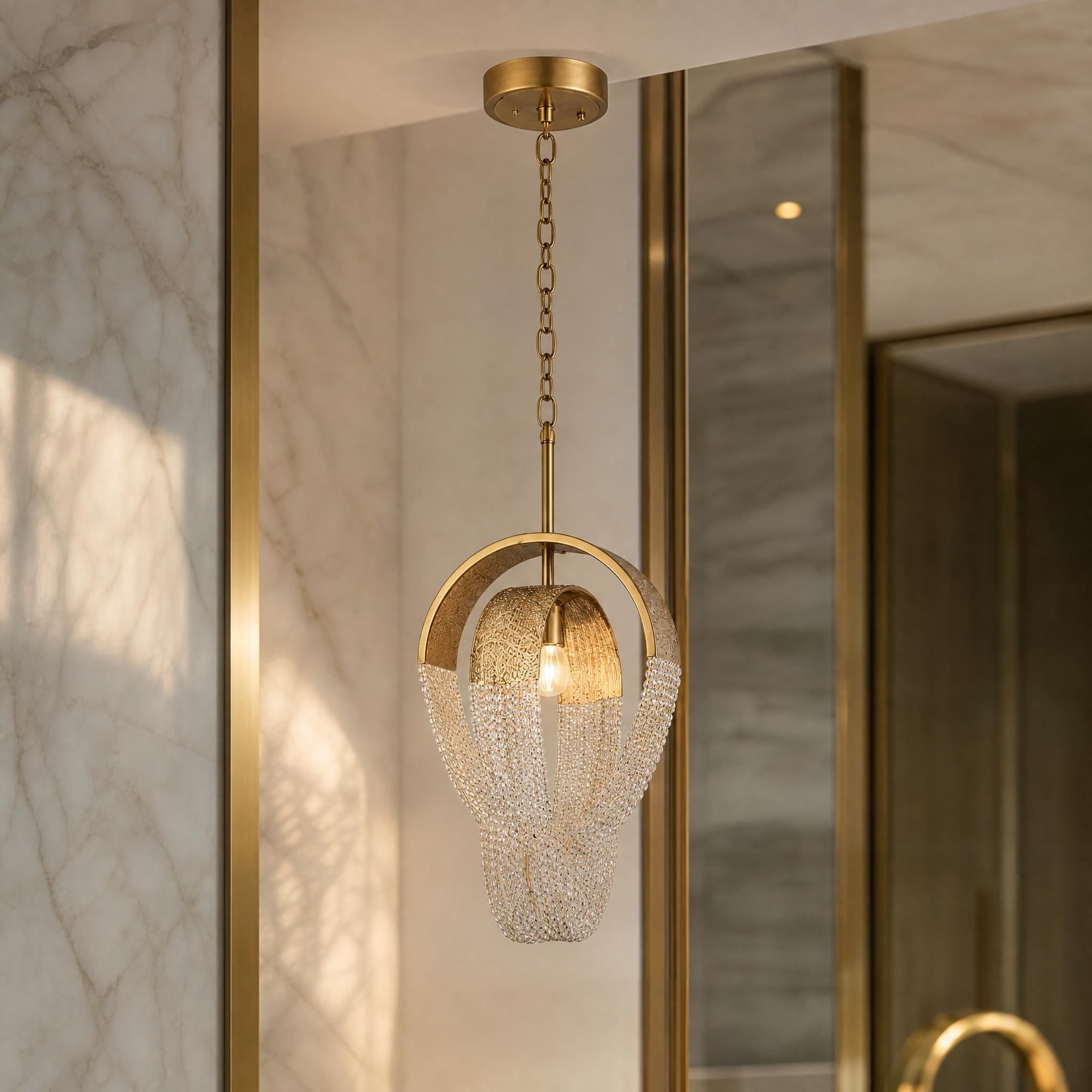 A detailed closeup of the VORELLI Cindi pendant, highlighting the intricate crystal octagon chain as it gracefully drapes and catches the light.