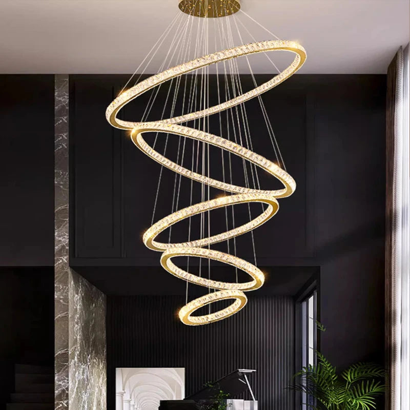 claremont ring staircase chandelier with cascading illuminated rings in luxury interior