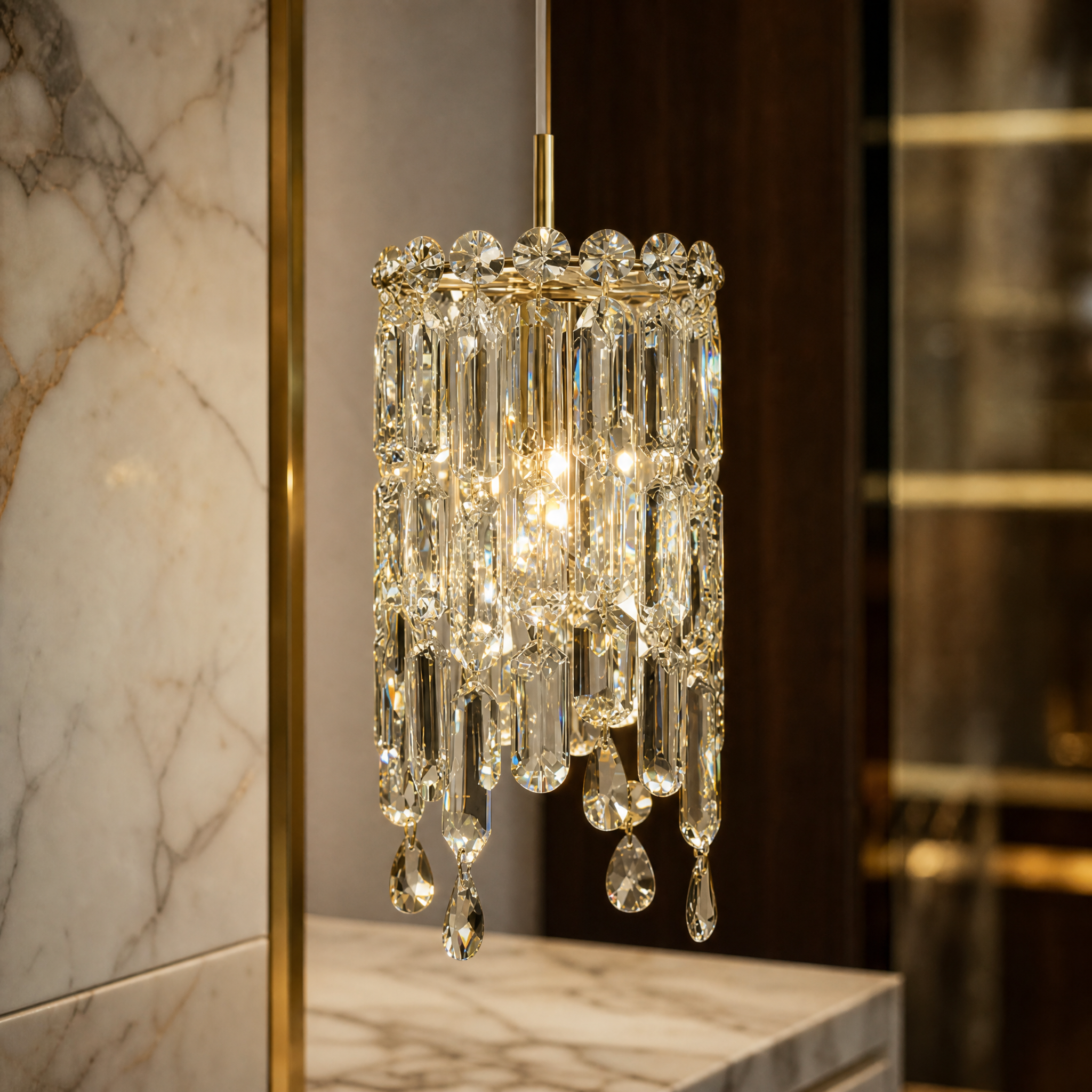 Close-up detail of the Abruzzi Pendant Light by VORELLI, highlighting the intricate geometric crystal patterns and brilliant light refraction.