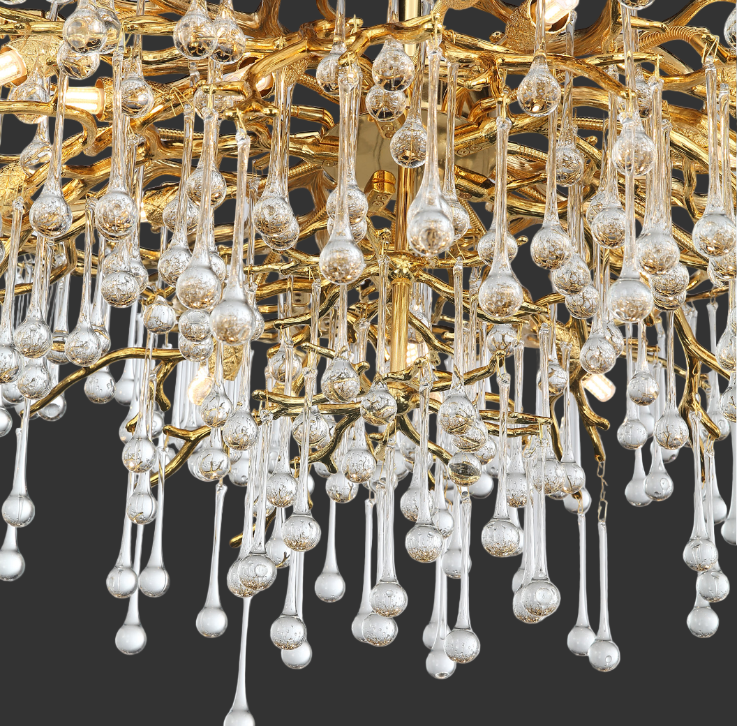 Detailed macro shot of the premium glass droplets and sculptural metallic branches of the Vorelli L’Albero d’Oro III luxury chandelier.