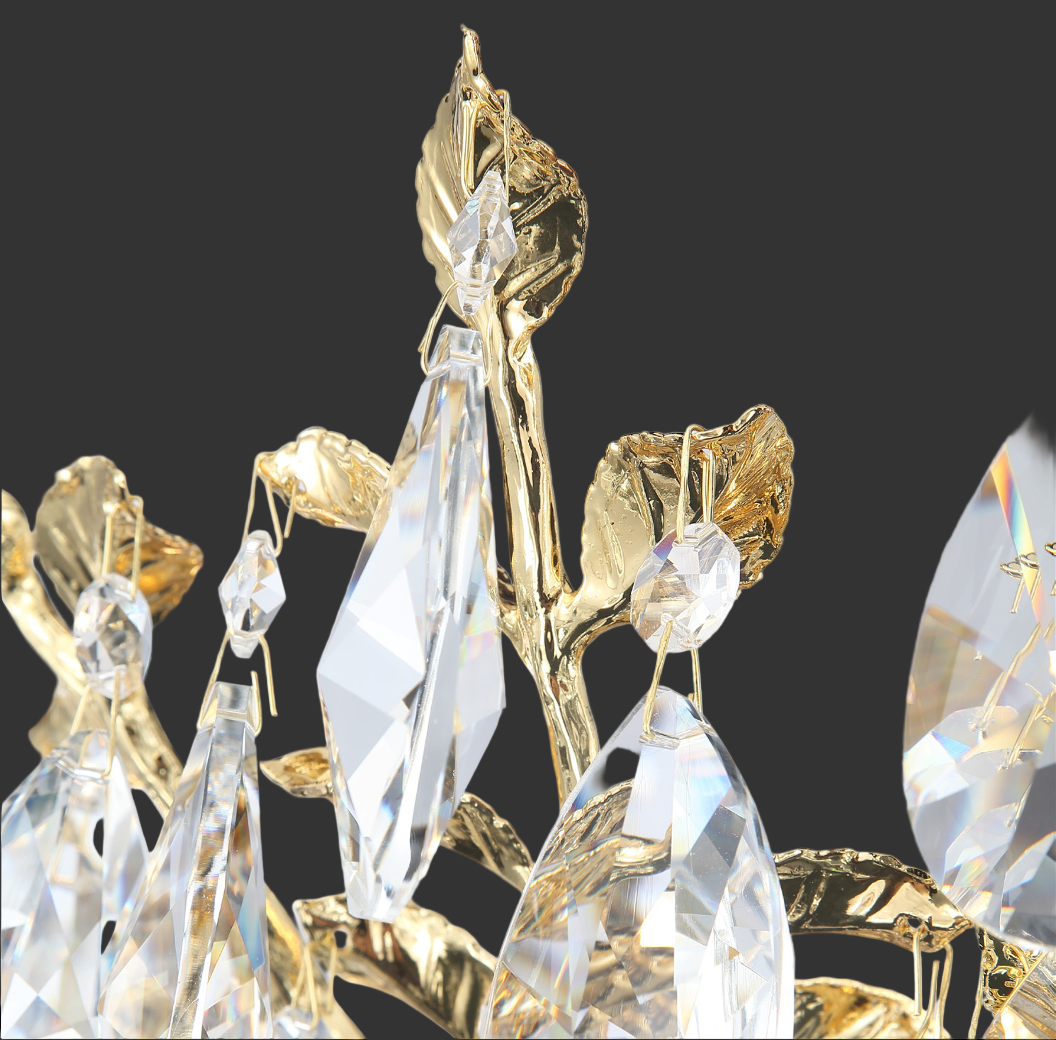 Close-up of gold sculpted branches with clear teardrop crystal petals