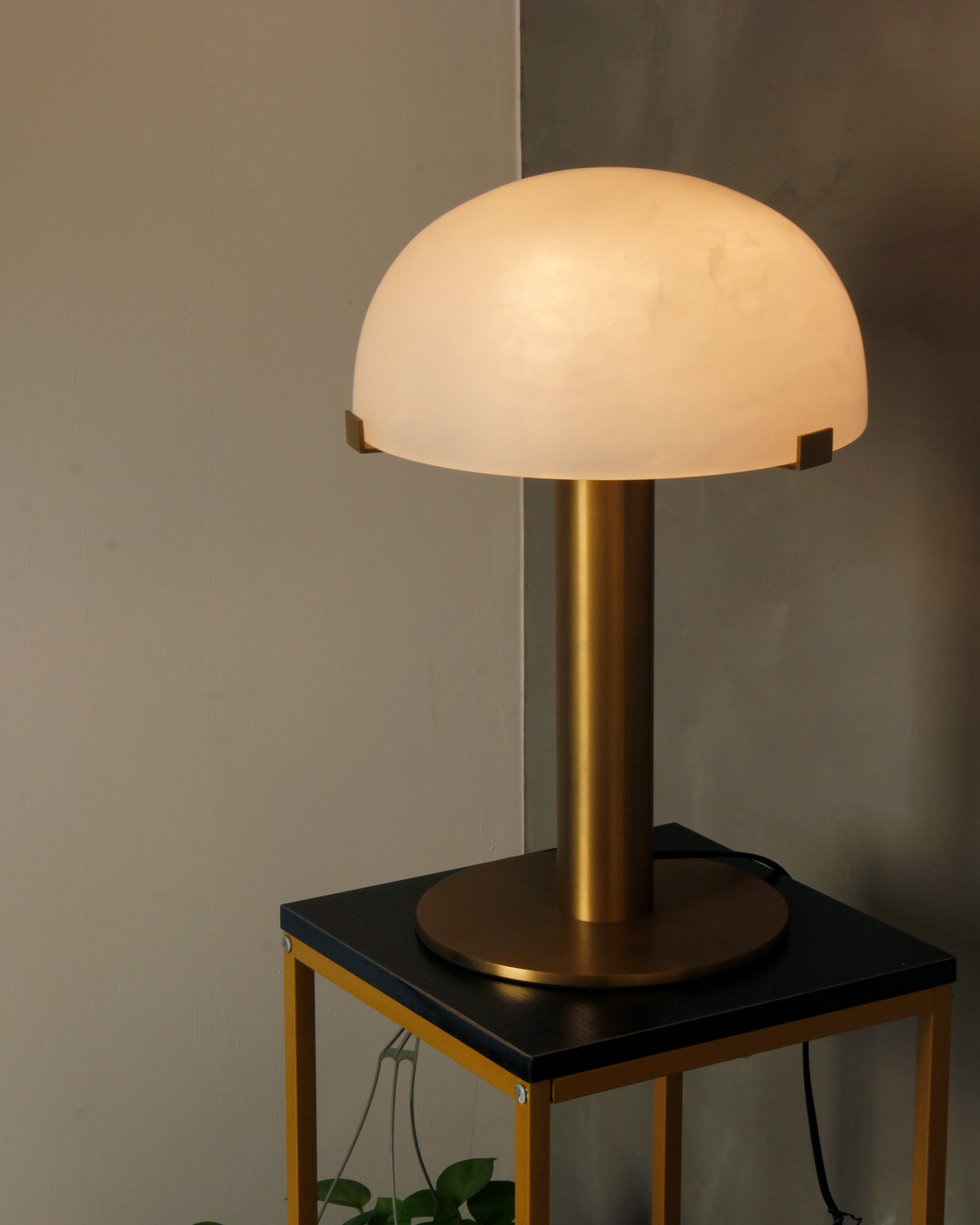 Dome Marble Table Lamp on a modern table, displaying warm ambient glow