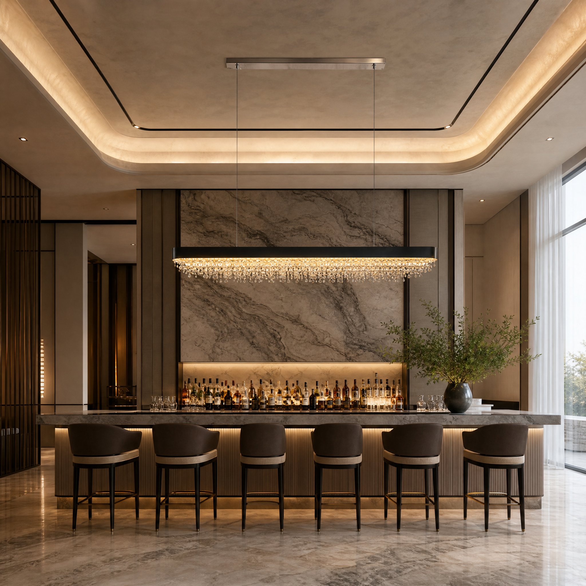 The grand VORELLI Donatello oval crystal chandelier suspended in an upscale hotel lobby, casting a warm, luxurious glow.