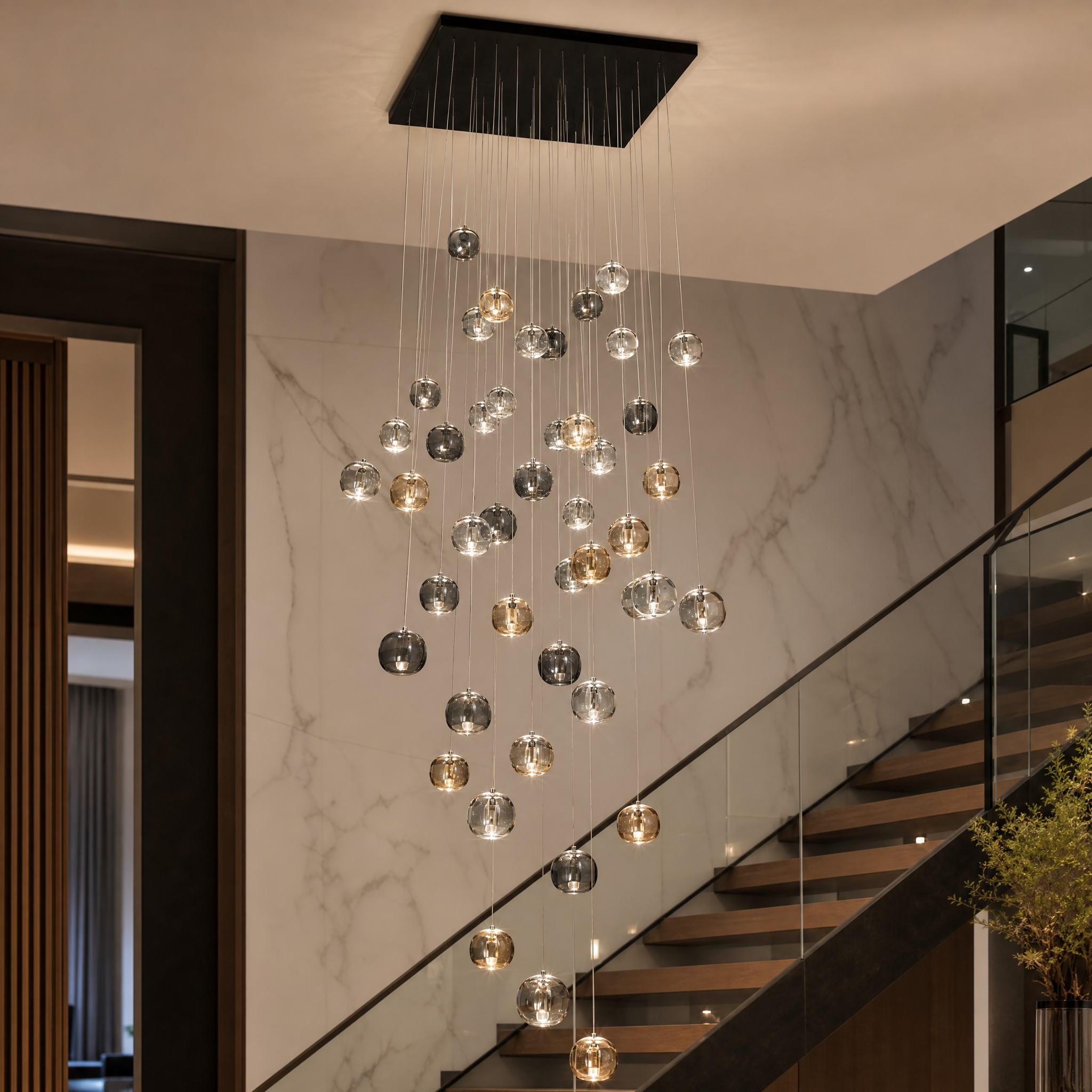 Macro closeup of the exquisite Amber, Clear, and Smoky Grey crystal globe pendants from the VORELLI Emiliano modern luxury chandelier collection.
