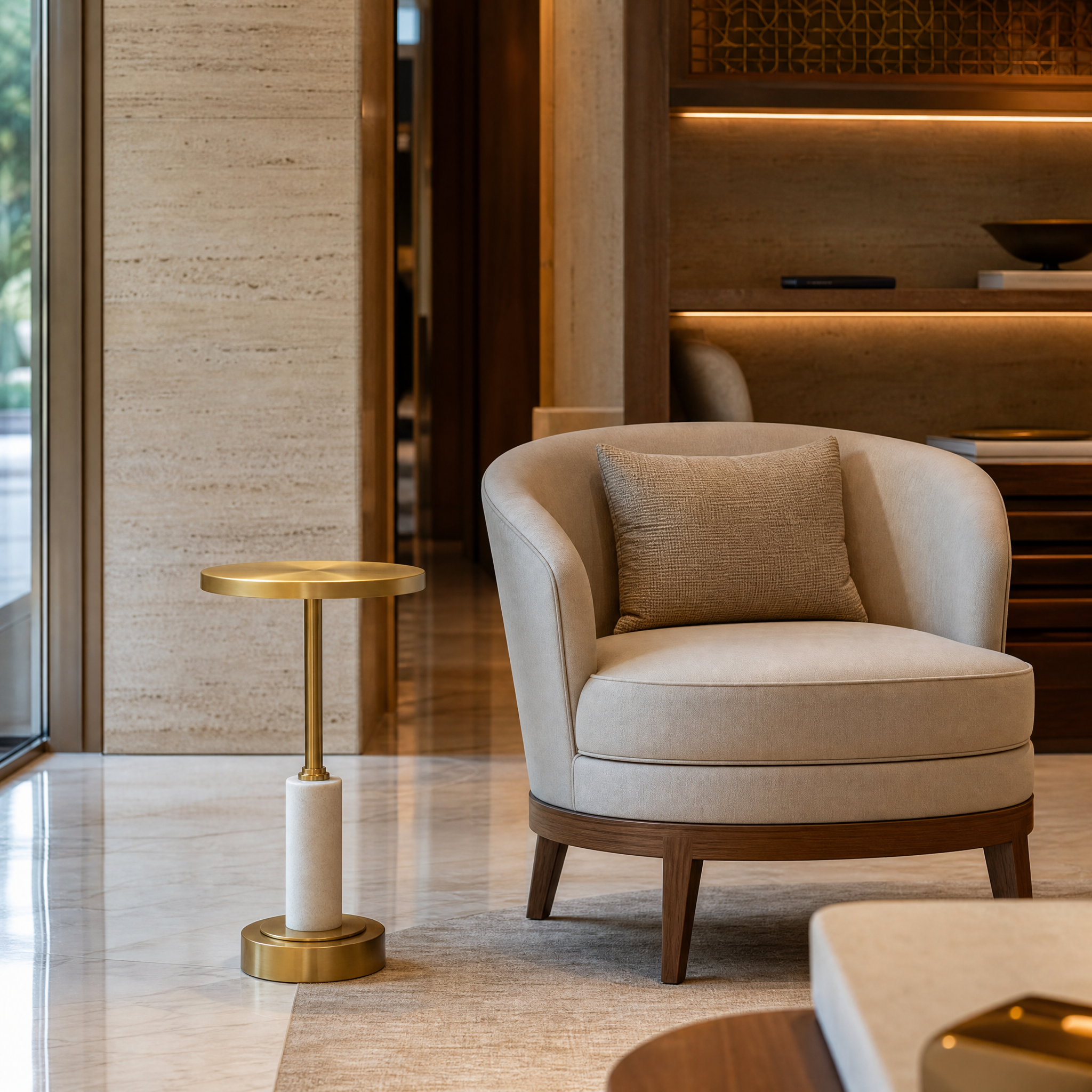 The sculptural Erdevo brass and white marble side table elevating a sophisticated hospitality lounge interior.