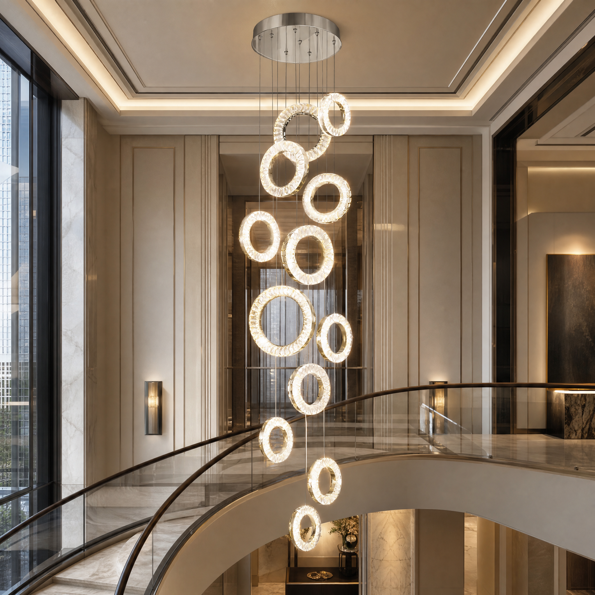 A dramatic hospitality installation featuring the VORELLI Farnham staircase chandelier hanging in a luxury hotel lobby with high ceilings.
