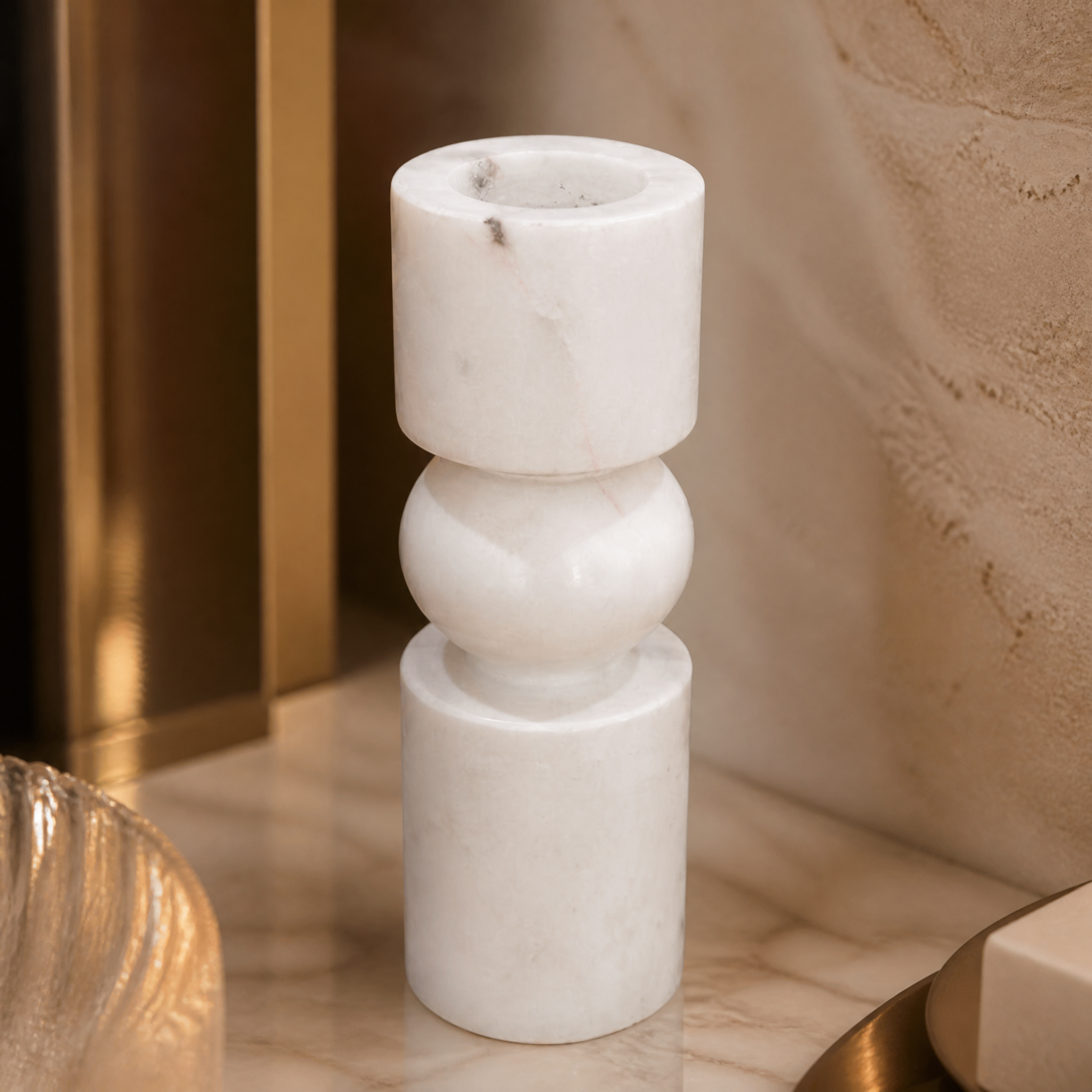 Macro view of the VORELLI Fiamma small candle holder showing the unique natural veining and softly rounded edges of the stacked geometric white marble.