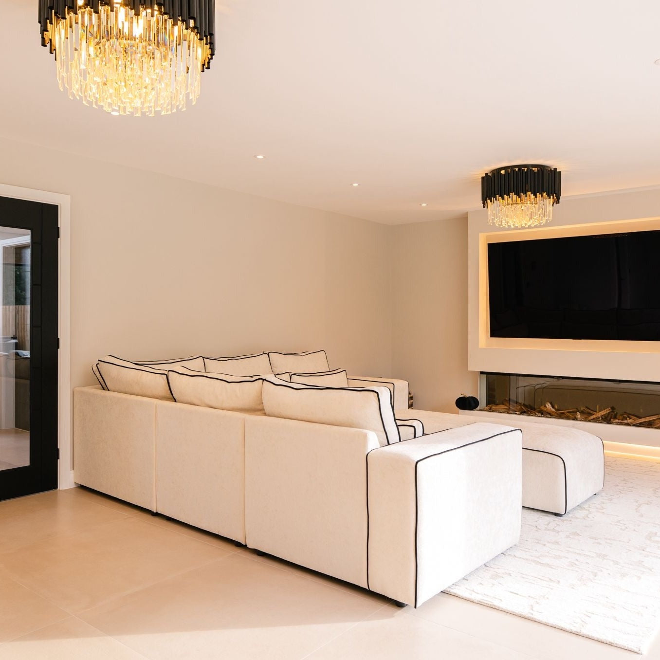 Gotham ceiling light styled within a luxury open-plan kitchen and seating area.