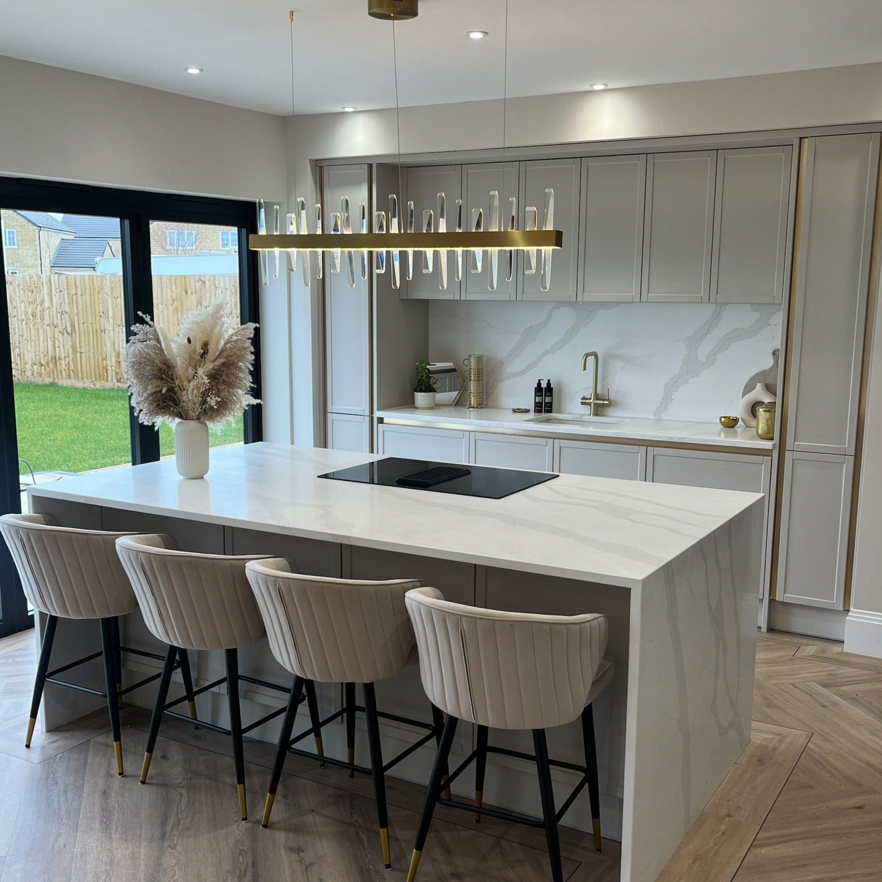 Grantchester Rectangular Chandelier illuminating an open-plan luxury interior space