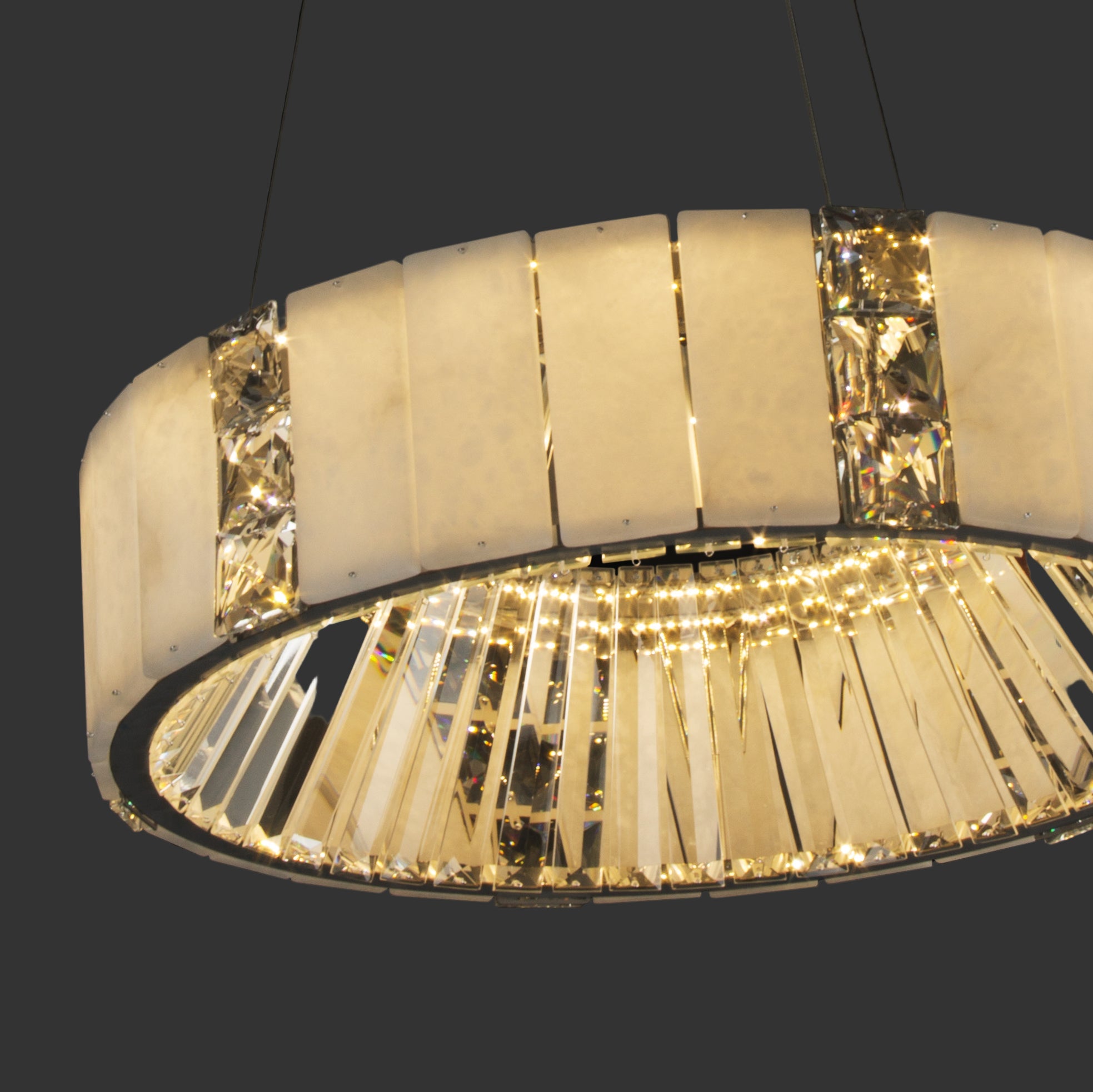Helios Marble Circular Chandelier showcasing its illuminated halo design with integrated crystal detailing