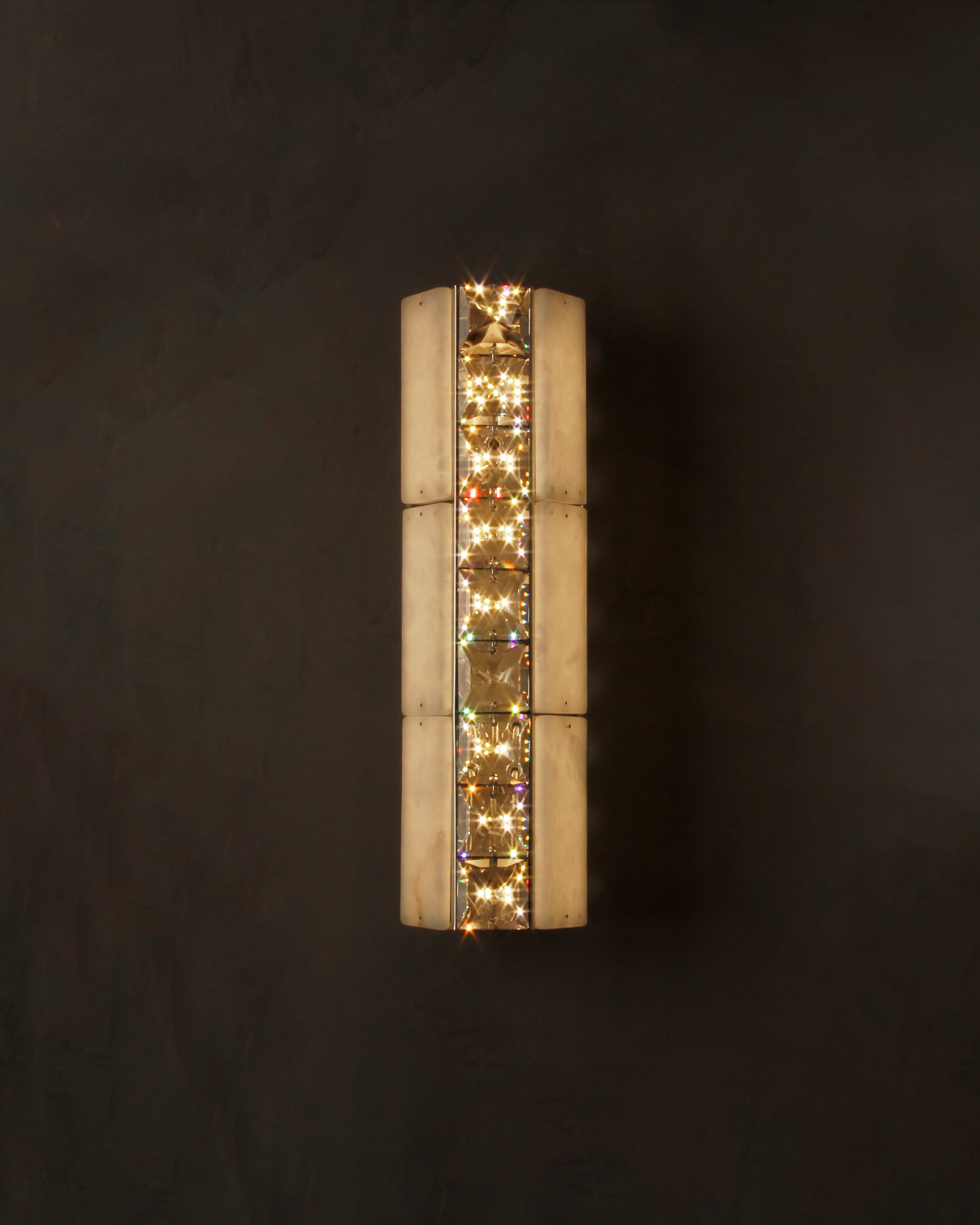 Helios Marble Wall Light installed in a luxury interior creating a warm ambient glow