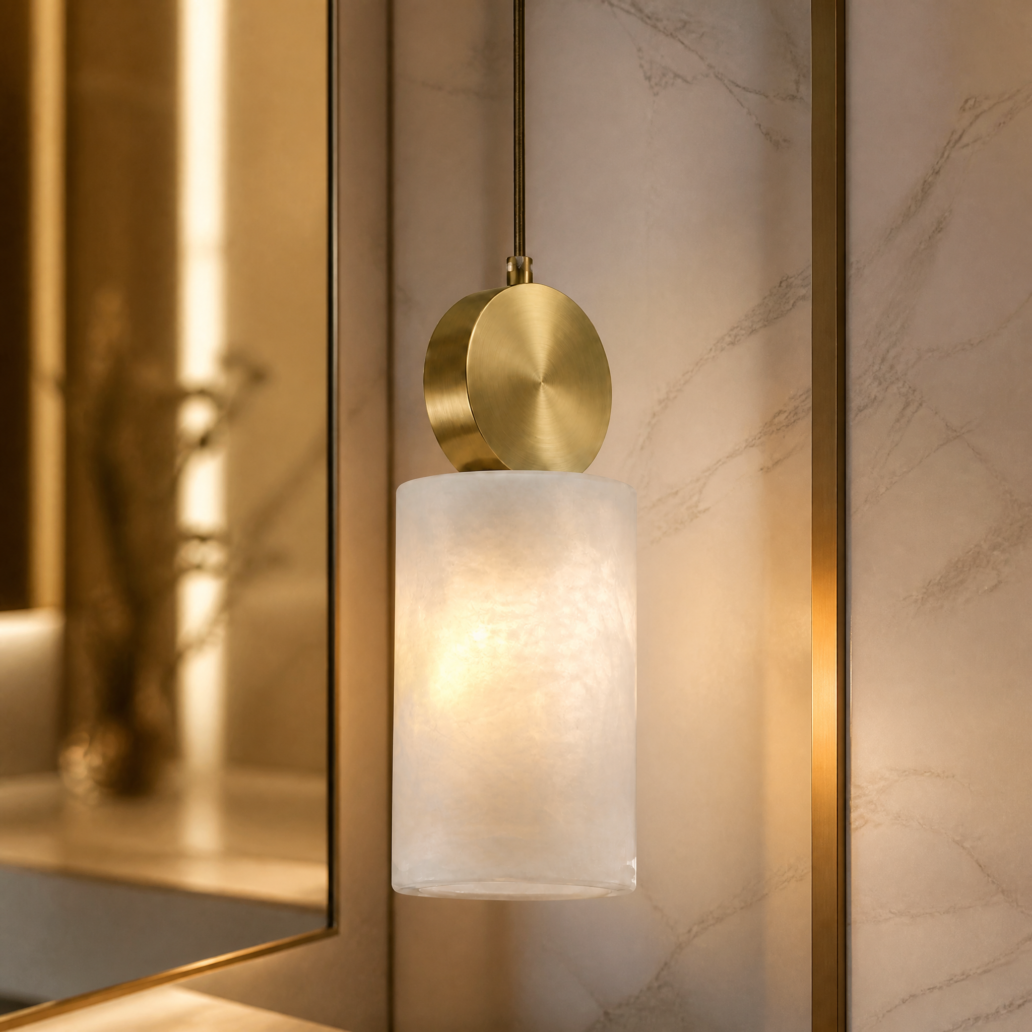 Close up view of the Hera marble pendant light showcasing smooth marble texture and premium golden hardware