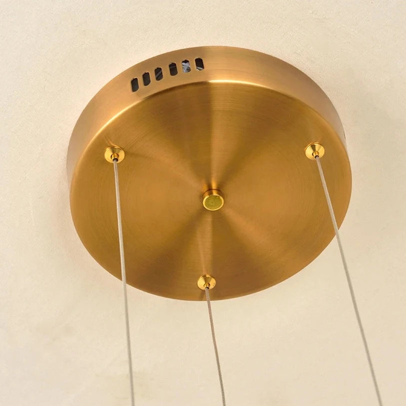 Hex Trio Circular Chandelier ceiling plate detail illustrating clean suspension design for modern luxury interiors