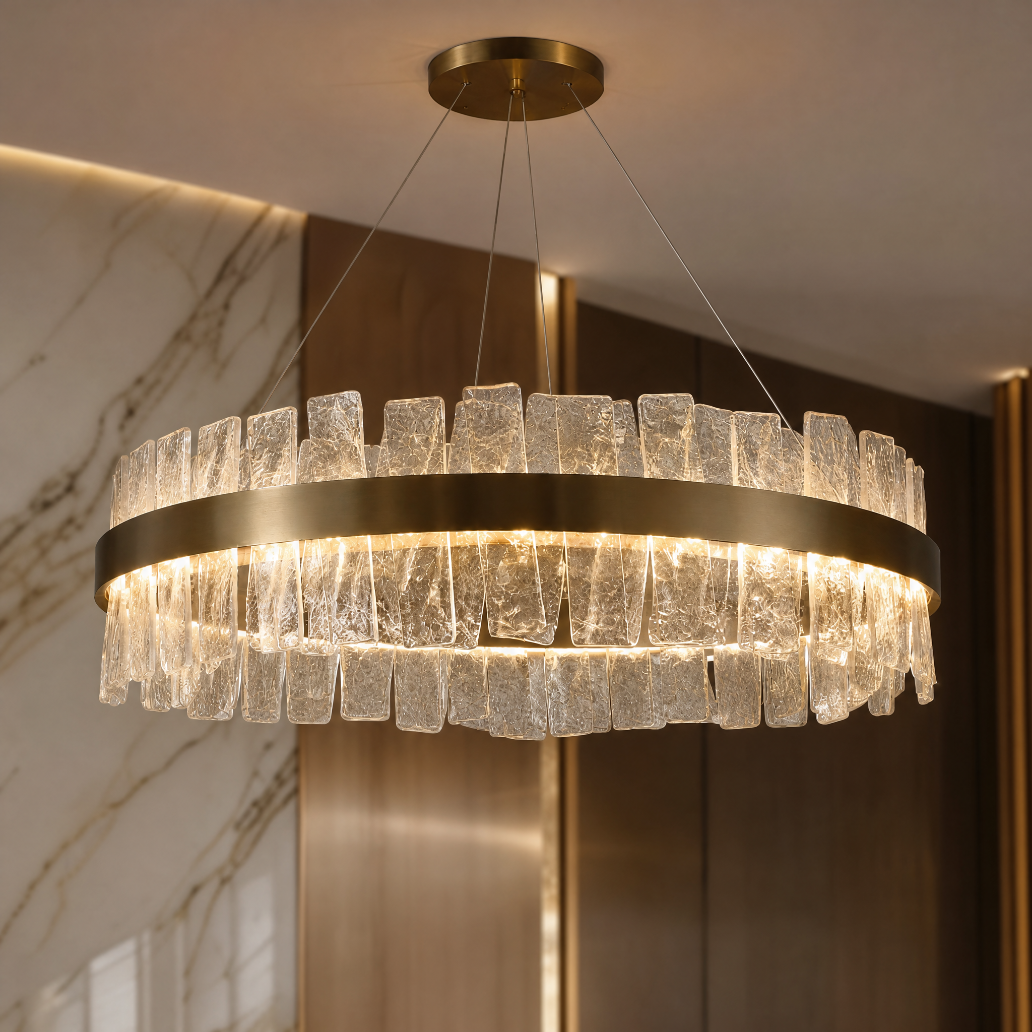 A detailed closeup of the VORELLI Kensington chandelier highlighting the unique textures of its luxurious cracked crystal accents and refined circular framework.