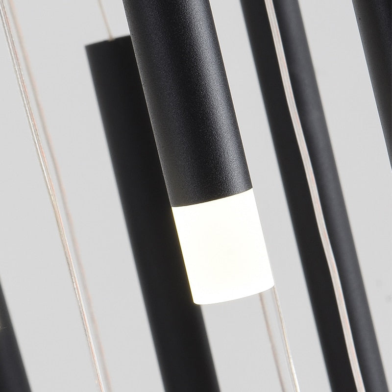 Close up of sleek black cylindrical pendants with soft diffused light