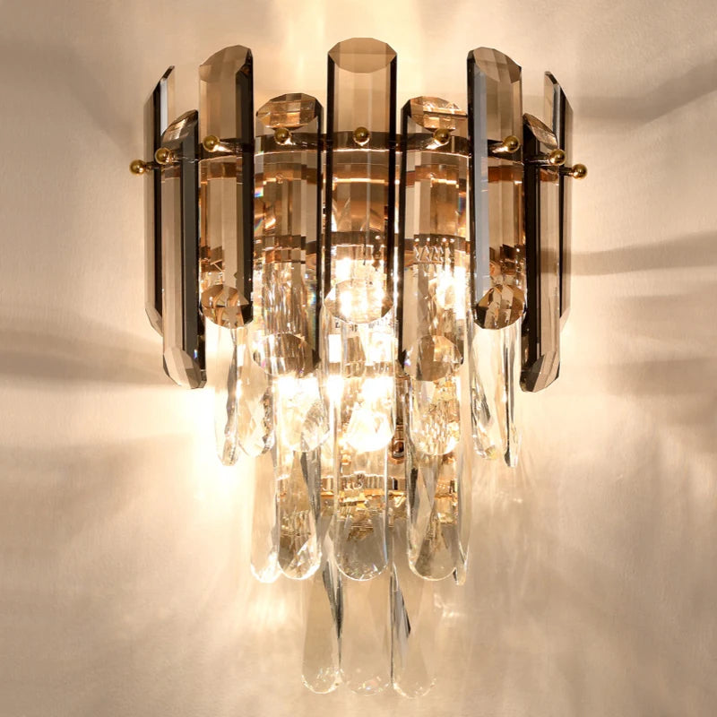 Close up of Lugano Wall Light showing semi elliptical diamond cut crystals and warm glow