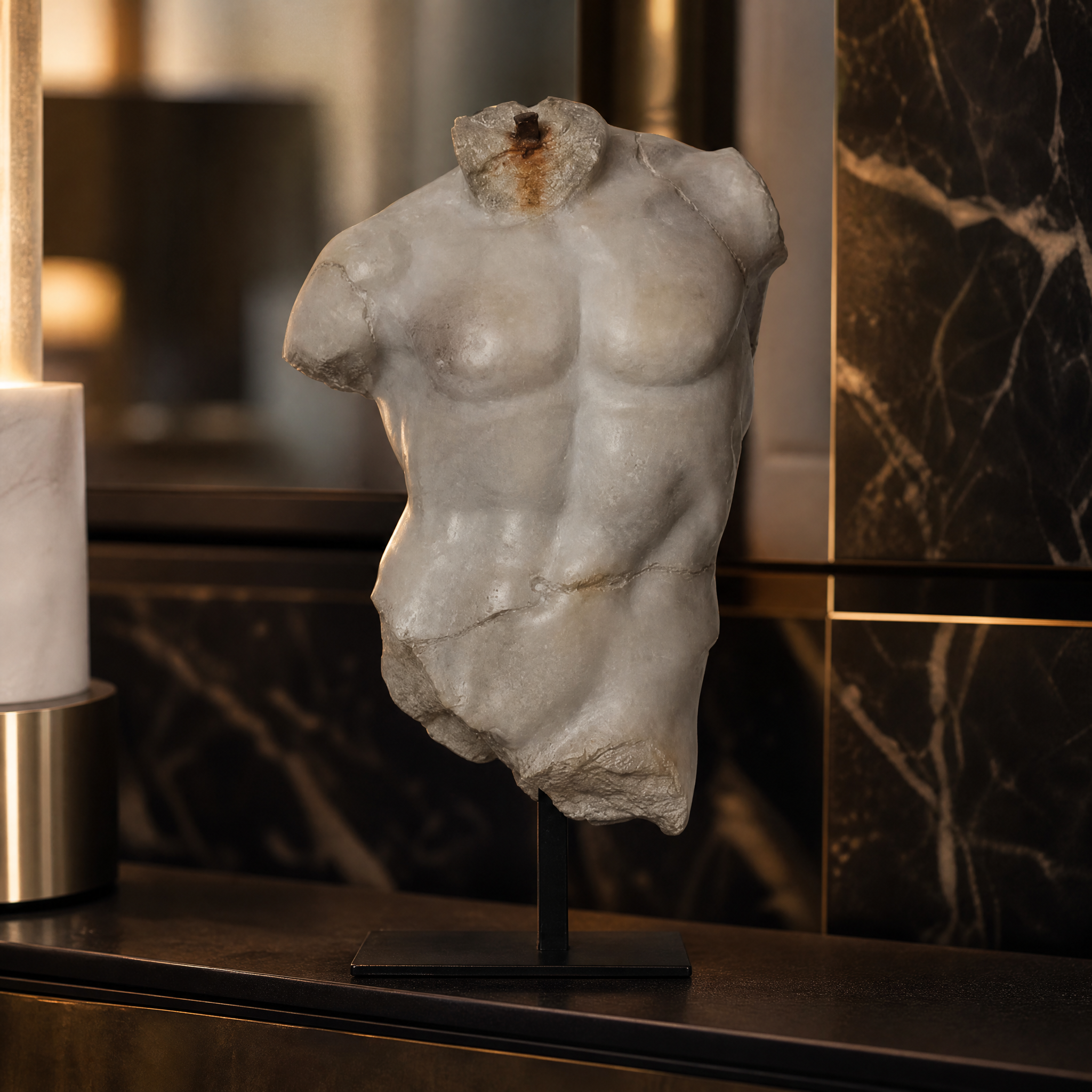 A detailed closeup of the Magnano large torso sculpture showing the textured antique plaster finish on durable polyresin.