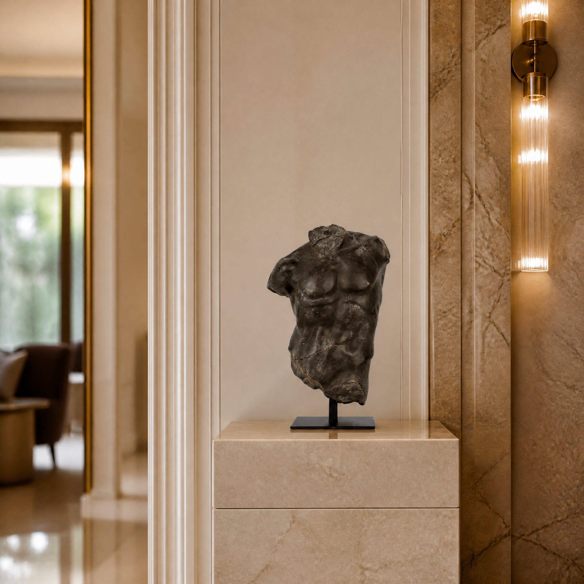 Antique bronze finished Magnano small torso decor by VORELLI displayed in a luxury hospitality setting or boutique hotel lobby.