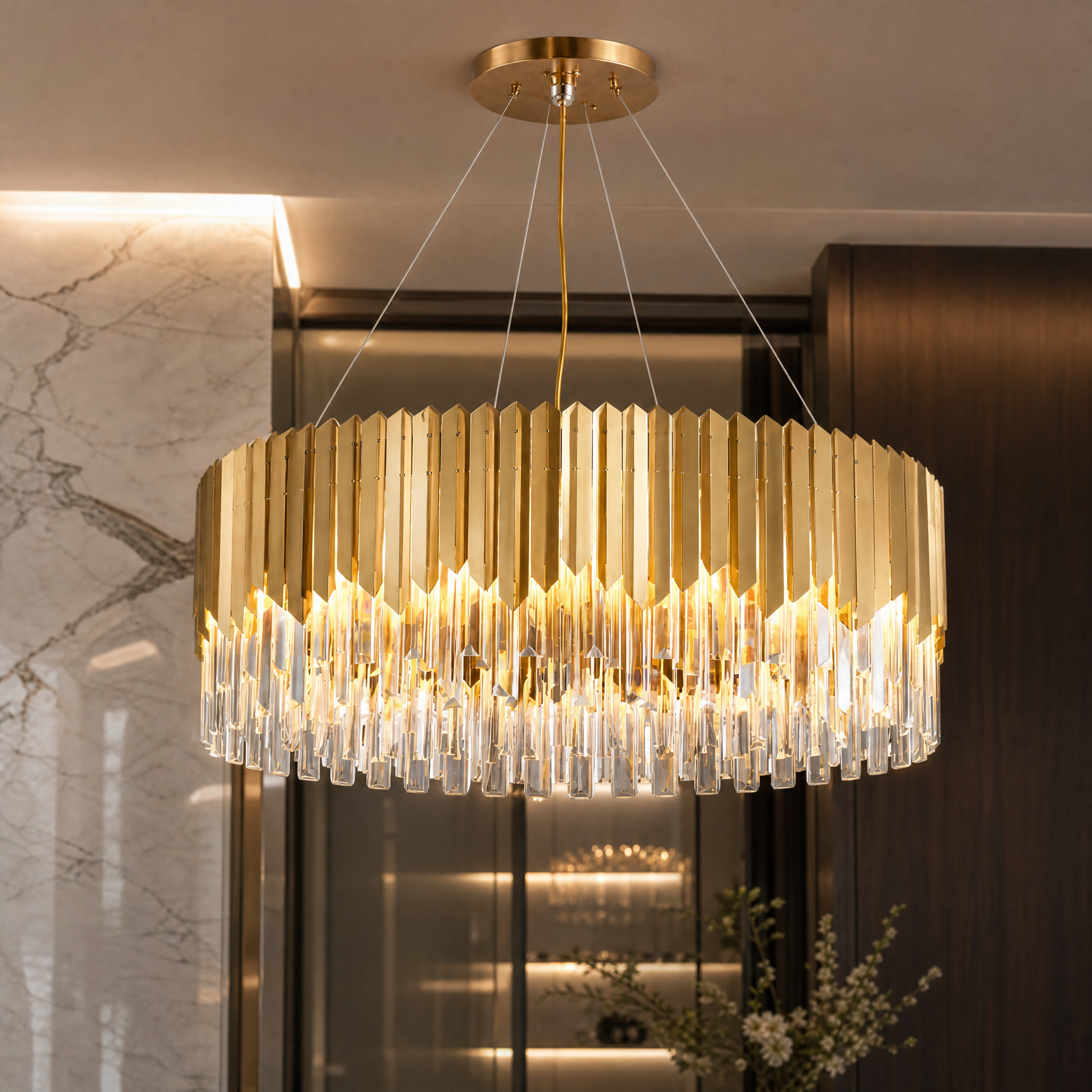 Detailed closeup of the VORELLI Manhattan Circular Chandelier, highlighting the sleek crystal bars and the intricate open centre halo lighting.