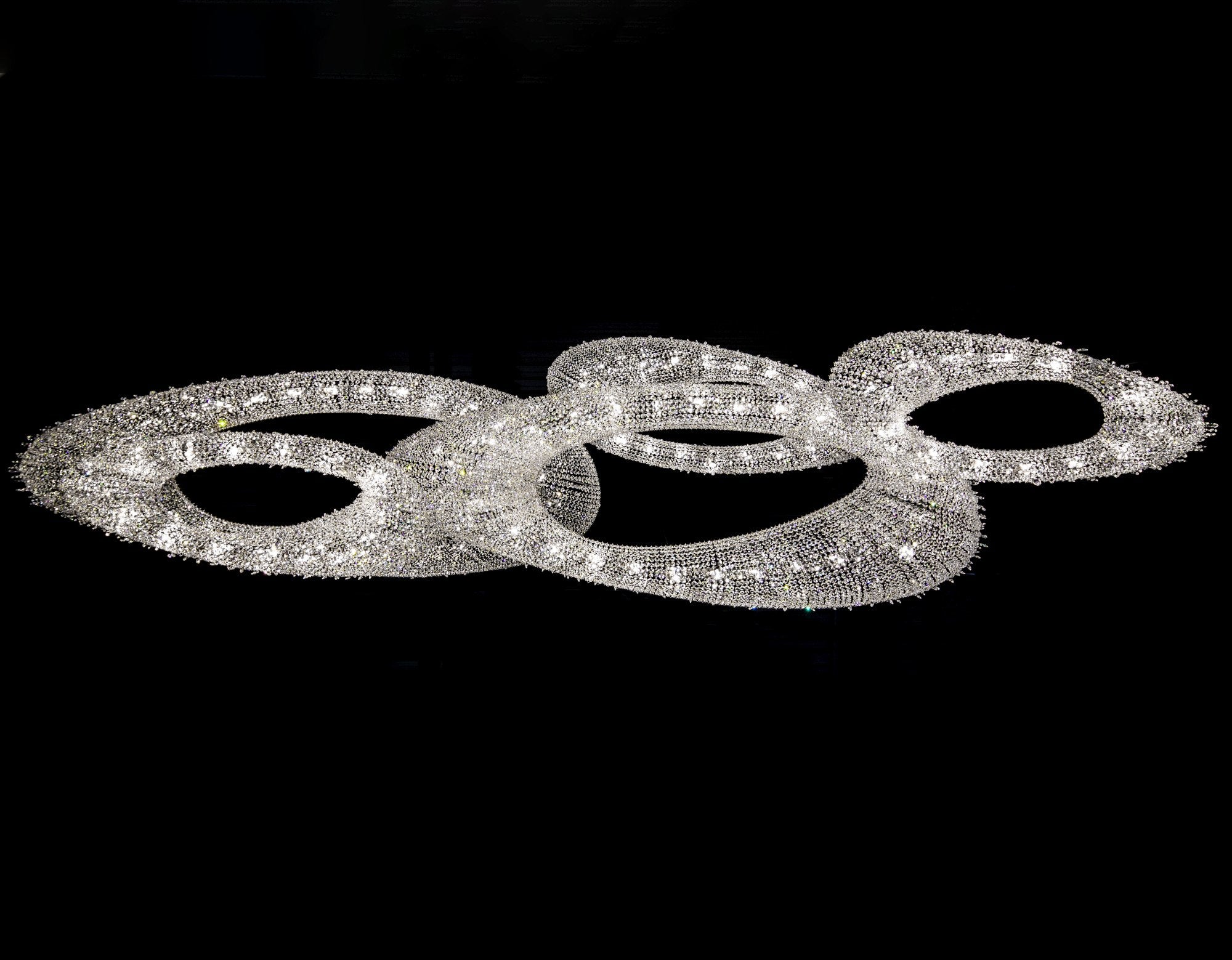 MANOOI Artica crystal chandelier showing its sculptural curved form