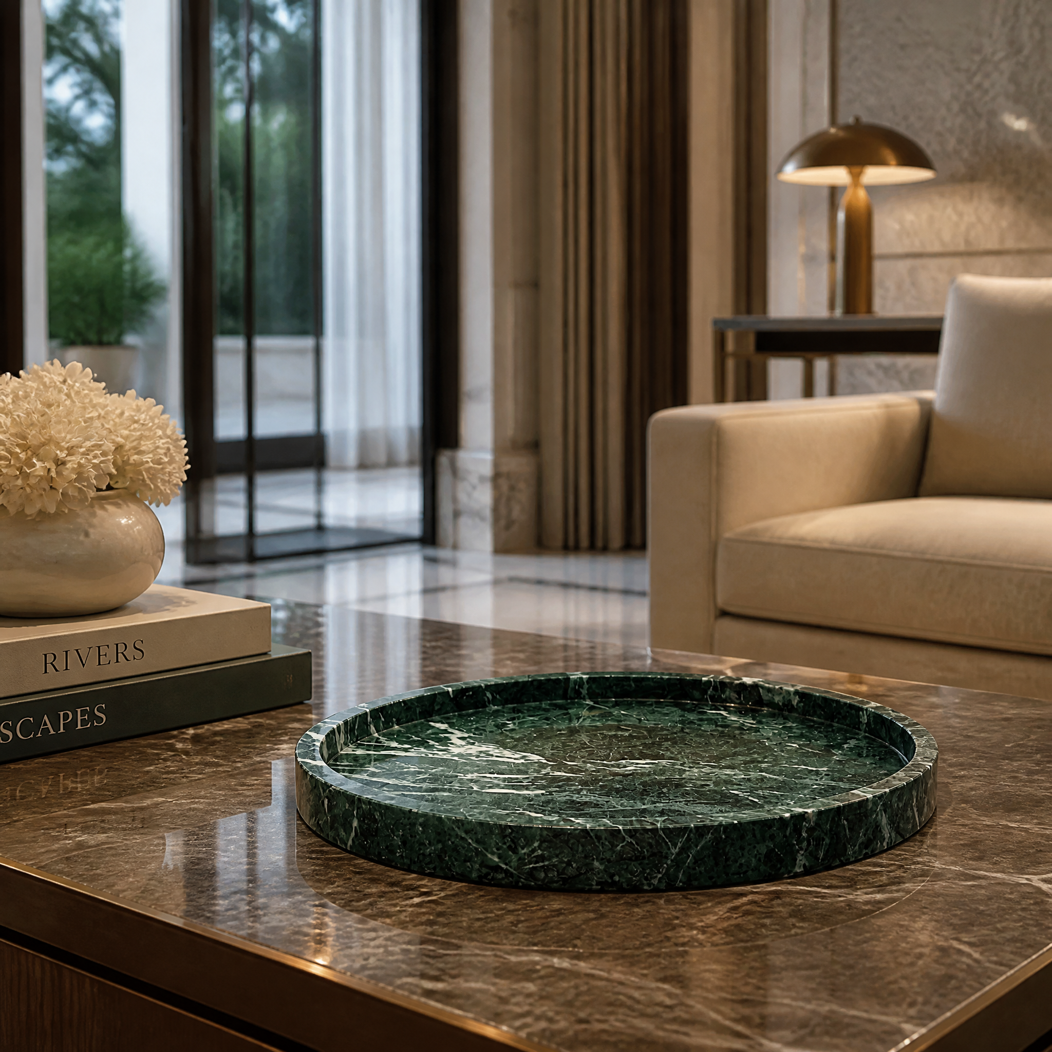 Premium green marble round serving tray set on a sleek bar console in a high-end hospitality lounge or boutique hotel.