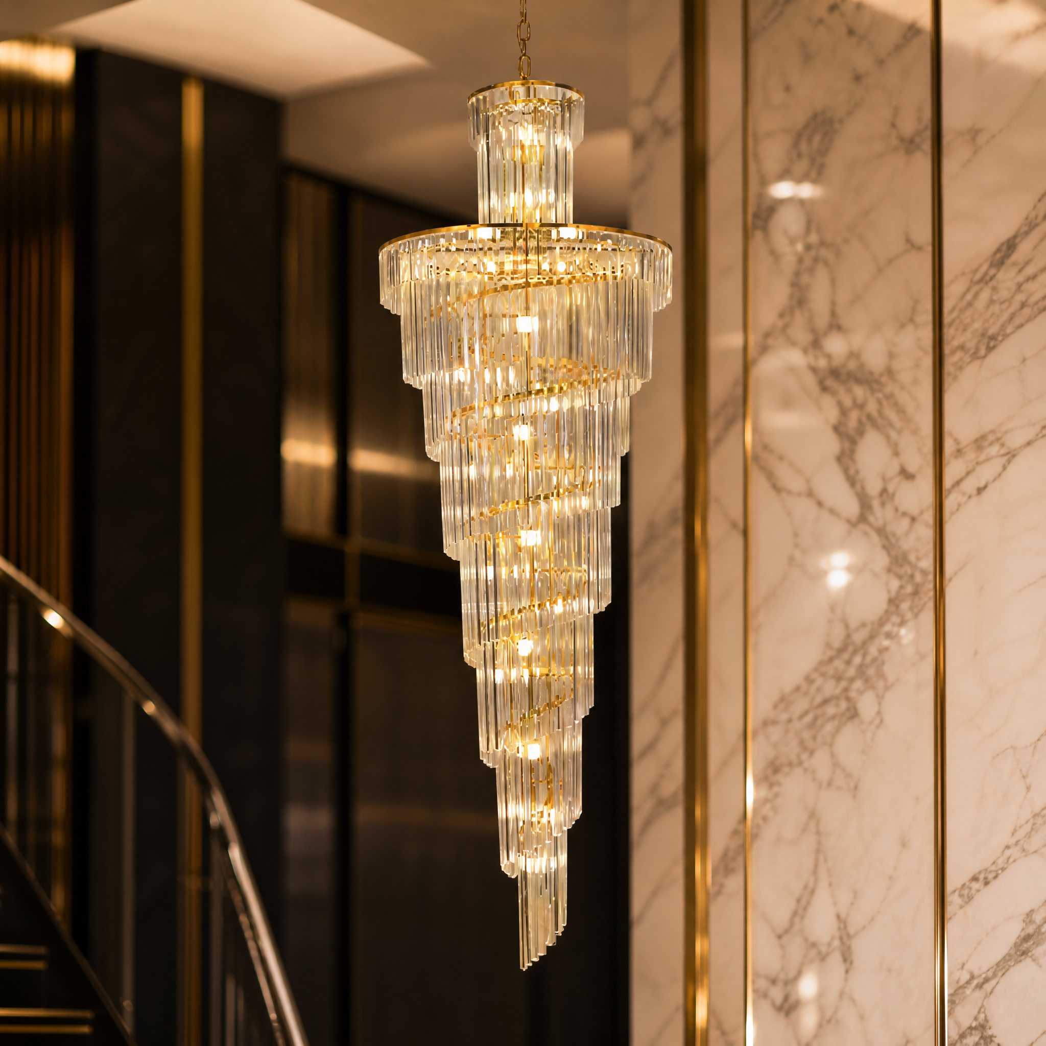 Close up detail of the stainless steel frame and tiered crystal bars of the Milazzo chandelier.