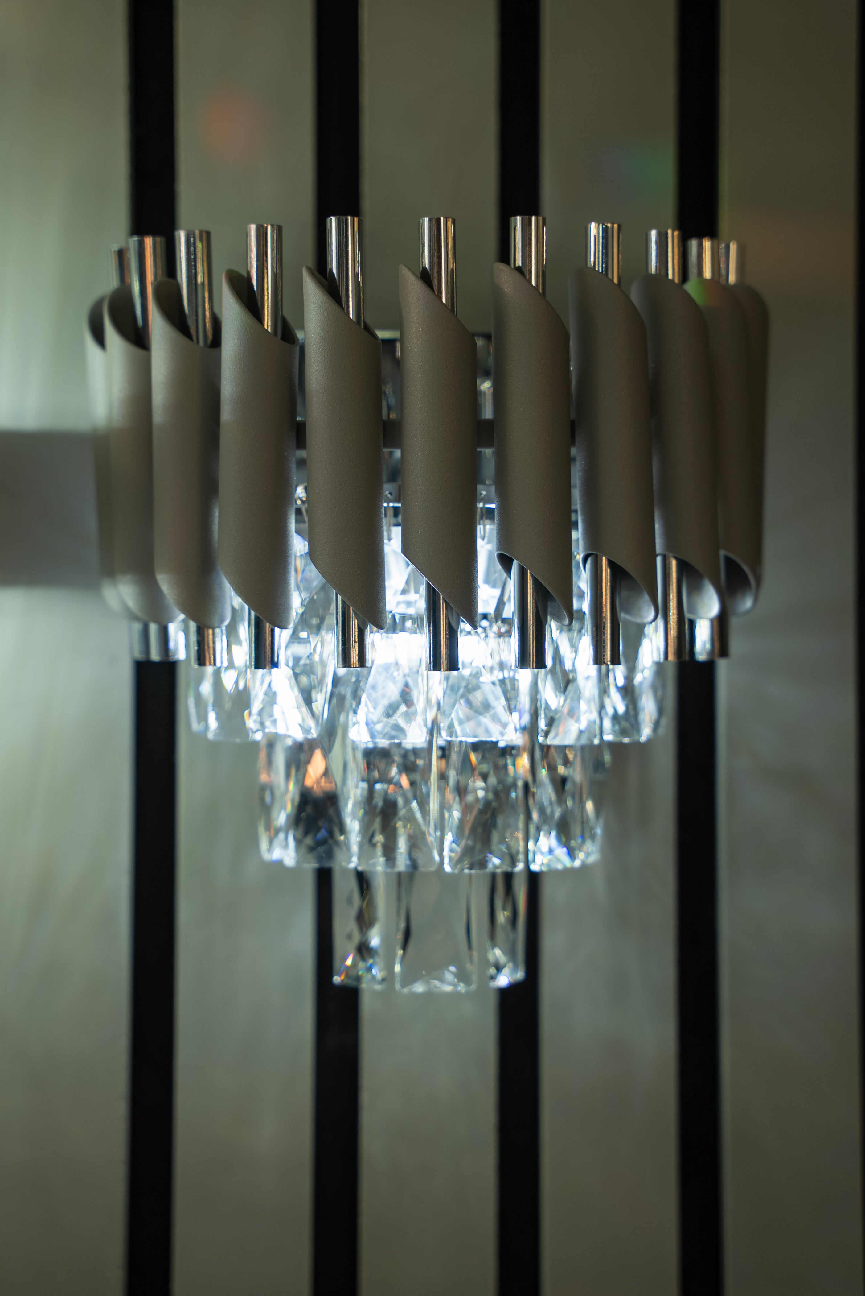Milltimber wall light with vertical cylinder tubing and clear diamond cut rectangular crystals