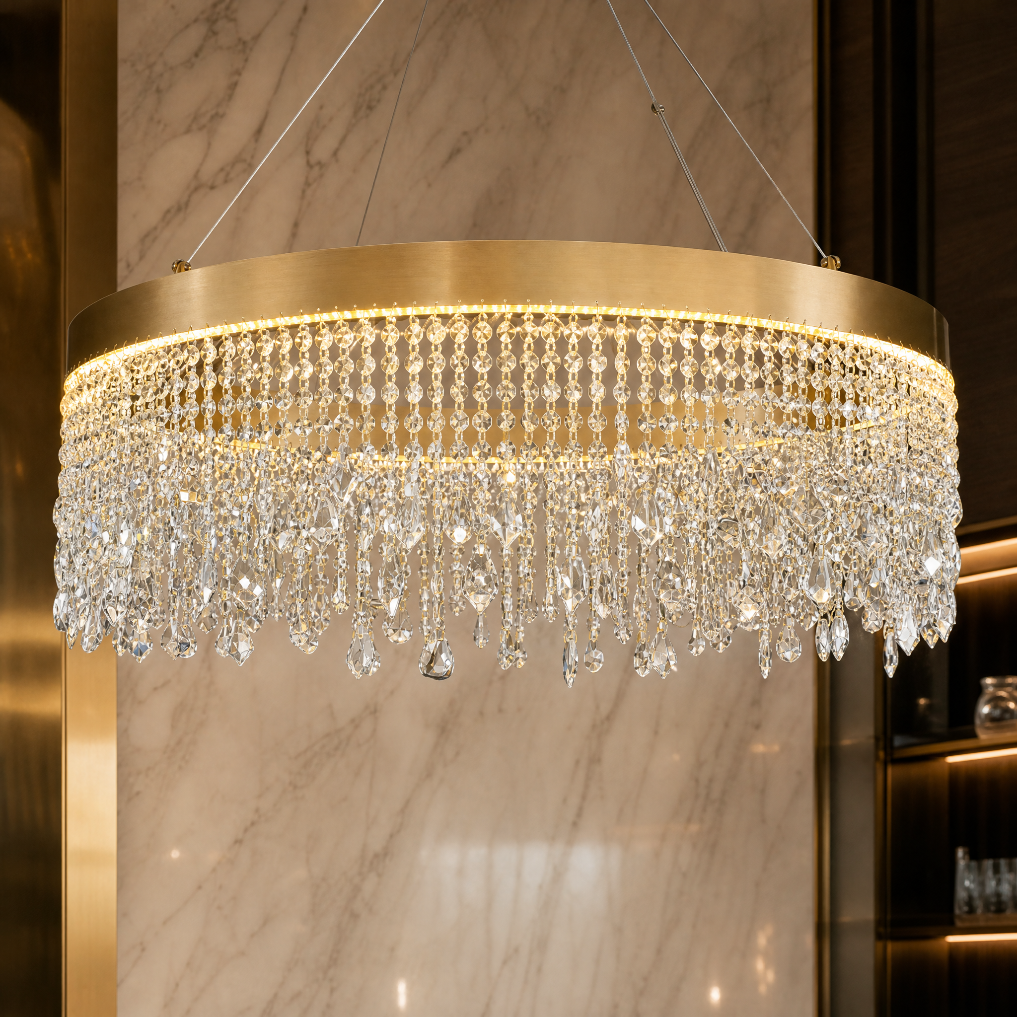 Macro view of the diamond-cut crystal chains and pear-shaped accents on the Modesto Circular Chandelier.