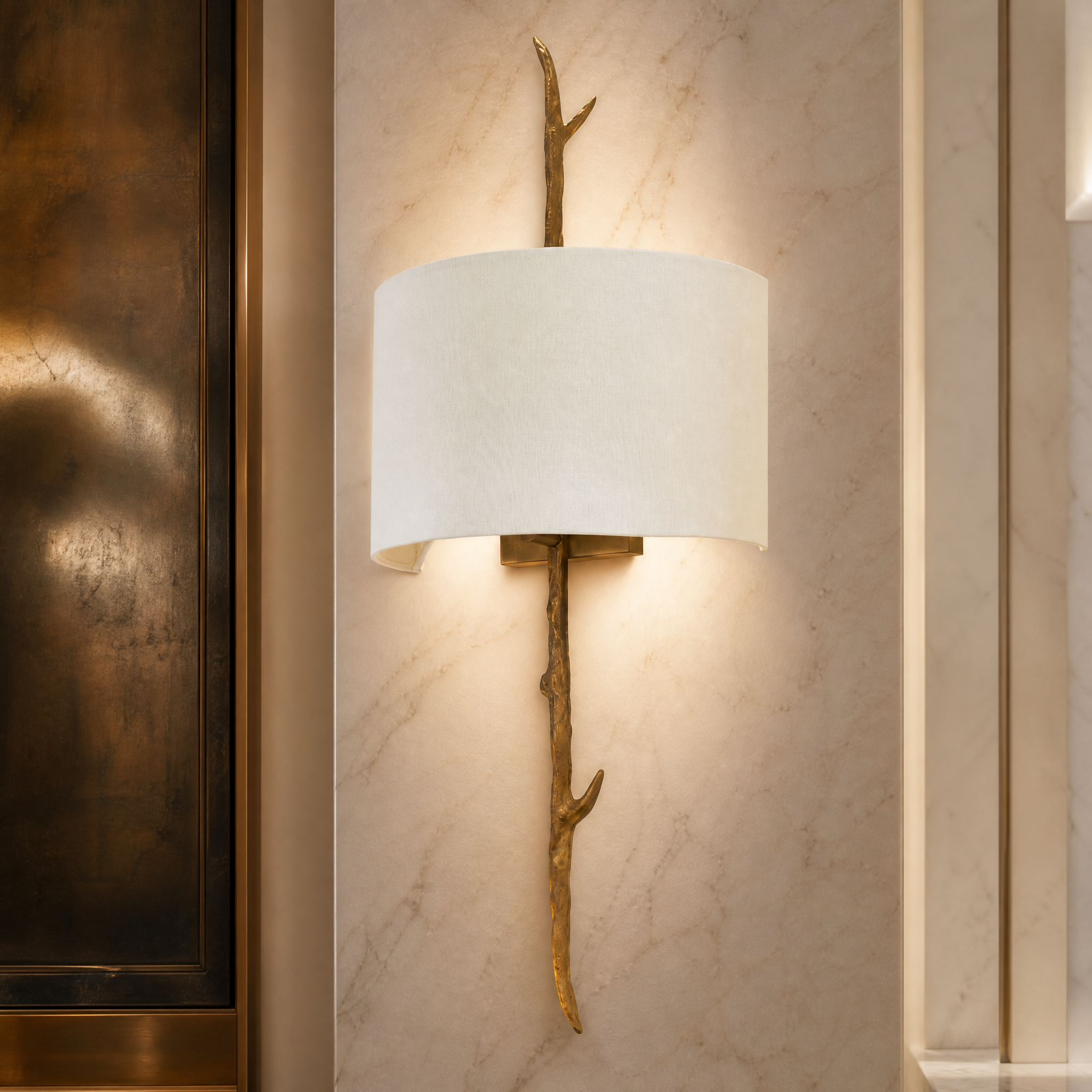 Macro detail shot of the Montvero wall light showing the polished brass texture and organic sculptural silhouette.