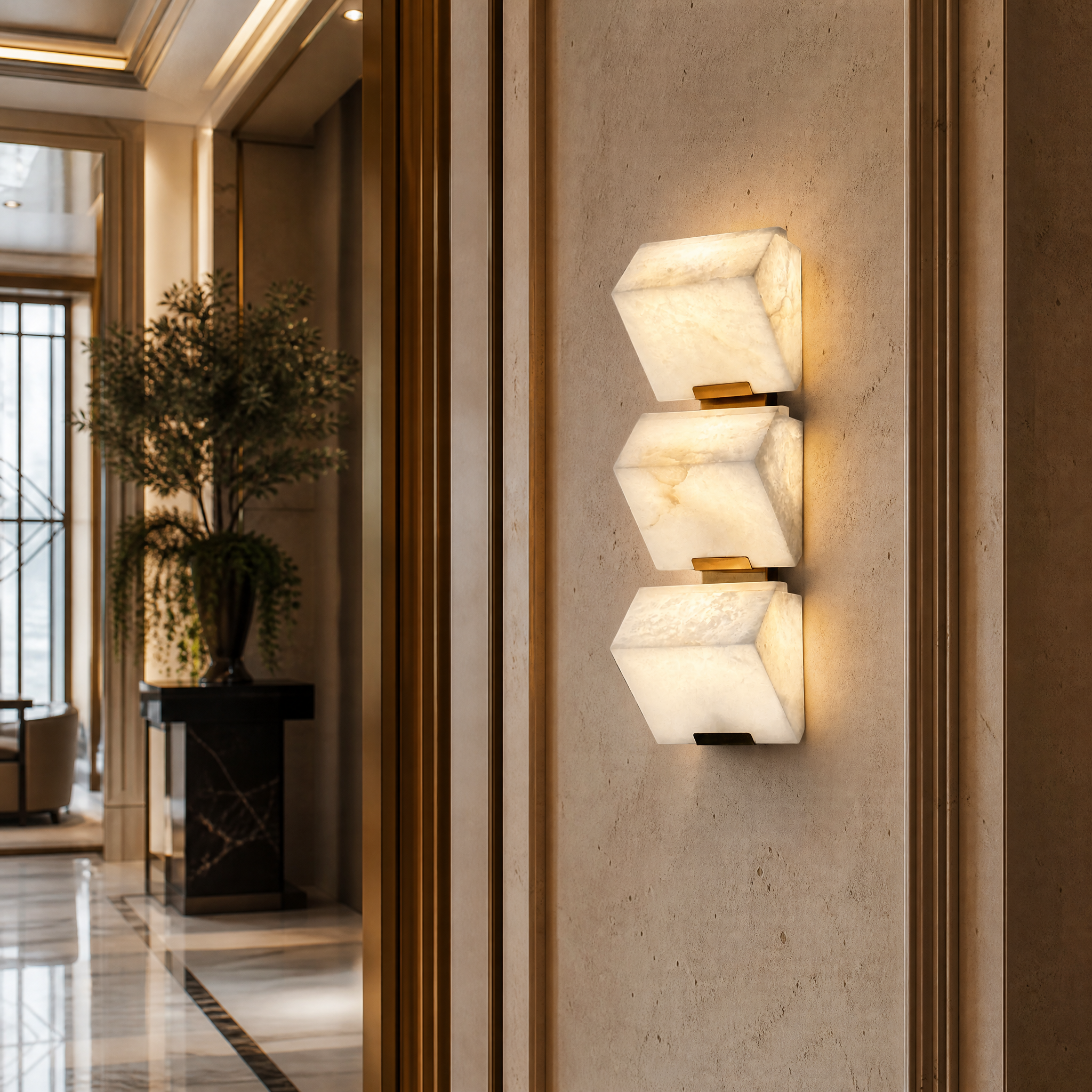 A sophisticated hospitality setting featuring the Novara three-piece marble wall sconce illuminating a high-end boutique hotel lobby corridor.
