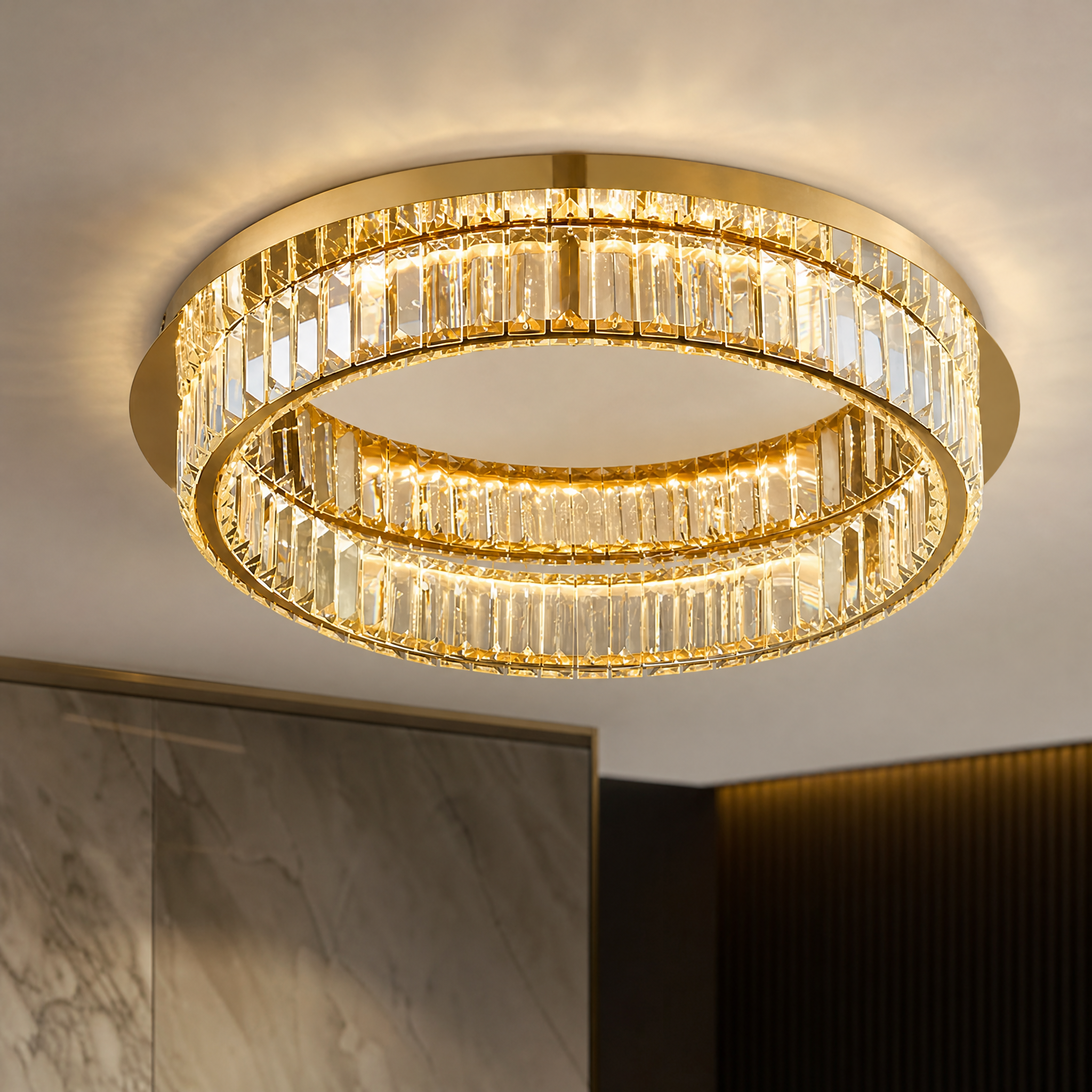A detailed close-up of the VORELLI Oia ceiling light, showcasing the high-end polished finish centre and the intricate texture of the surrounding shimmering crystal bars.
