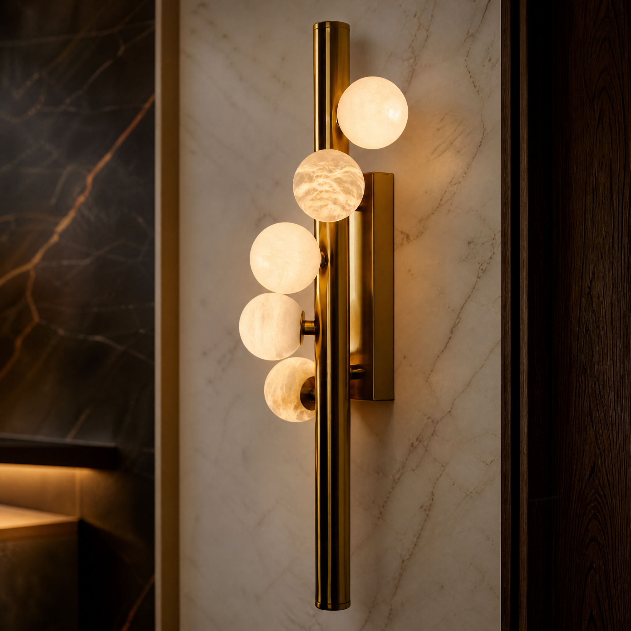 Macro closeup of the VORELLI Orbit Marble Wall Light, highlighting the natural veining of the spherical marble globe and its premium sleek vertical frame.