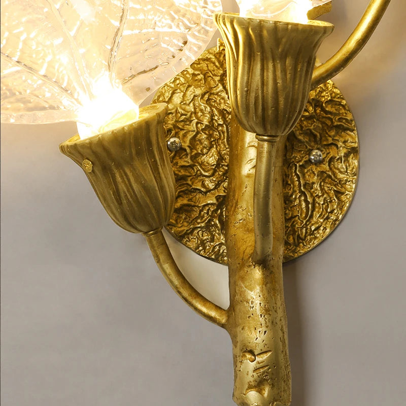 Sculptural wall mount and illuminated glass leaves of the Ottobre wall light