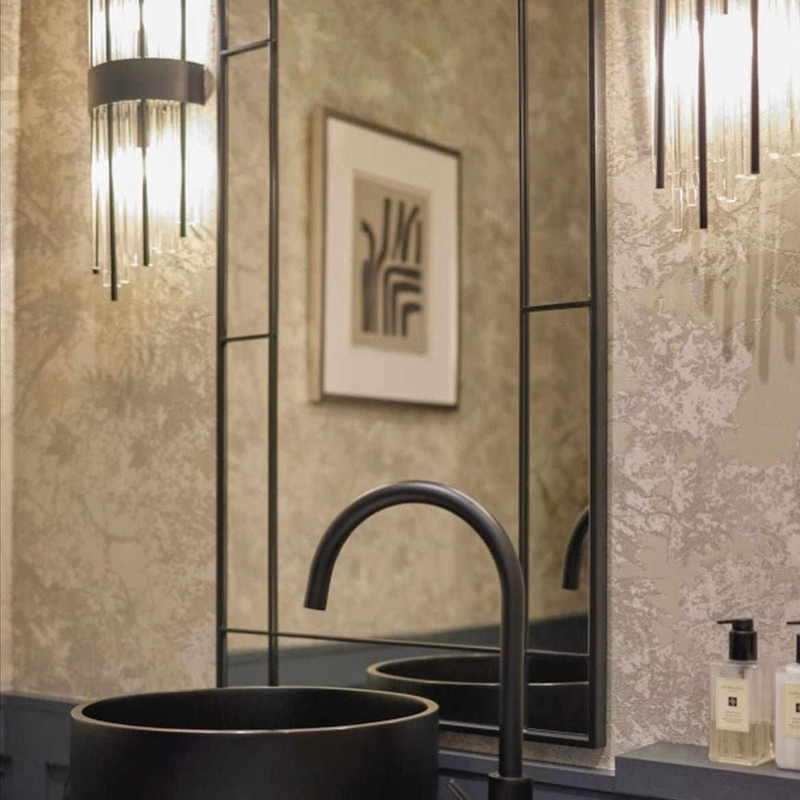 Piper Point modern cylinder wall light casting soft ambient illumination