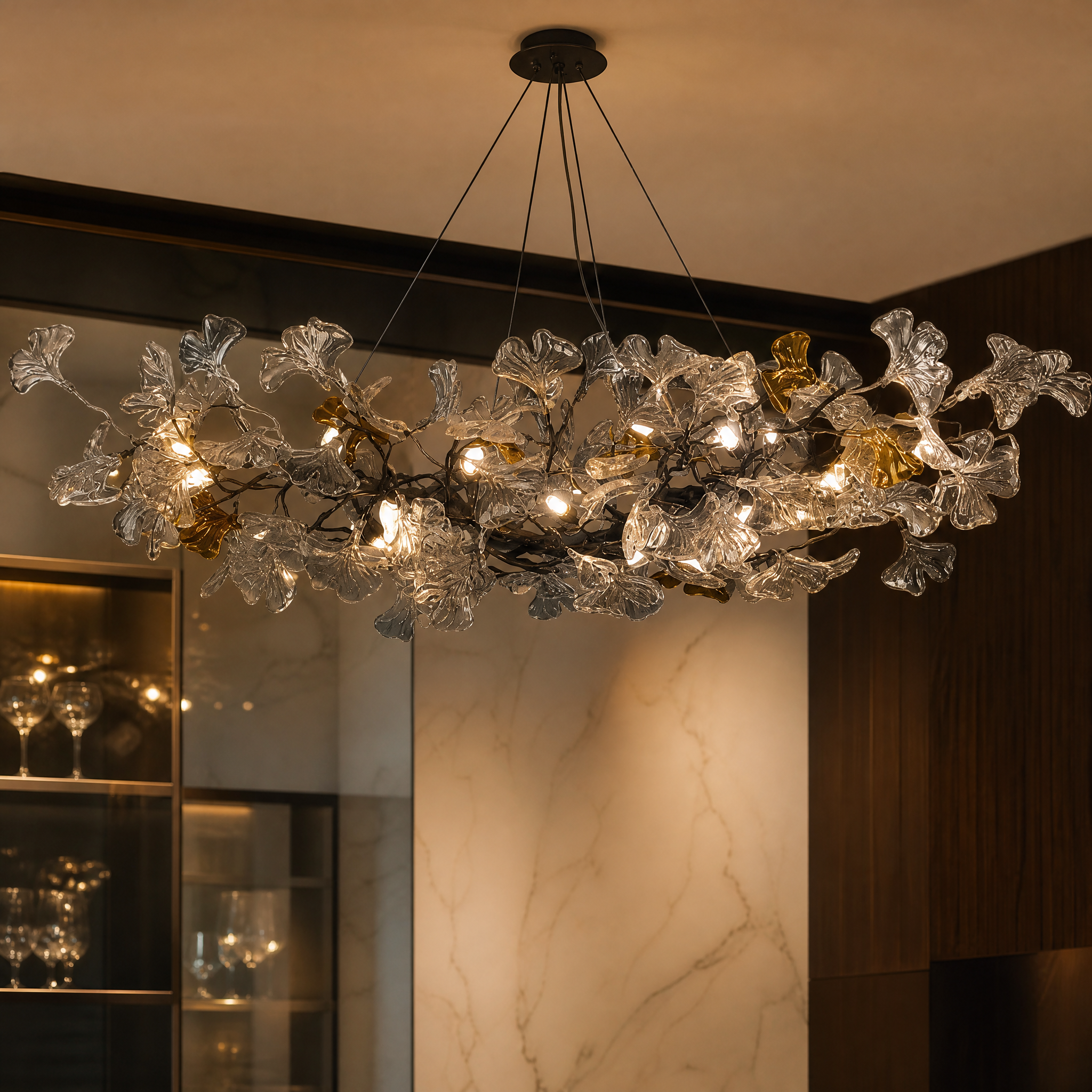 A close-up shot of the VORELLI Prano Chandelier detailing its exquisitely sculpted glass leaves and flowing organic silhouette.