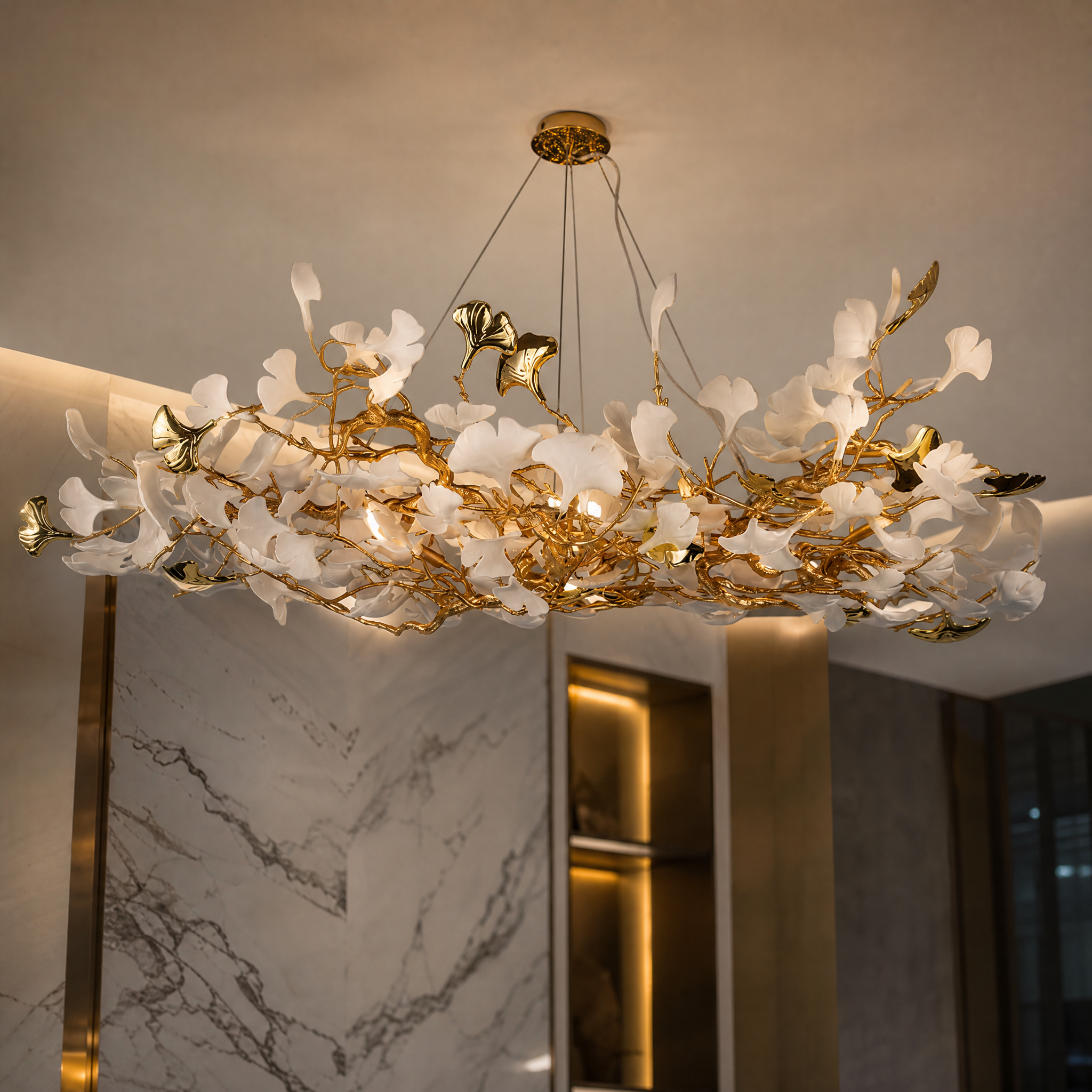 Detailed closeup of the organic botanical silhouette and individual handcrafted sculptural glass petals of the VORELLI Prano chandelier.