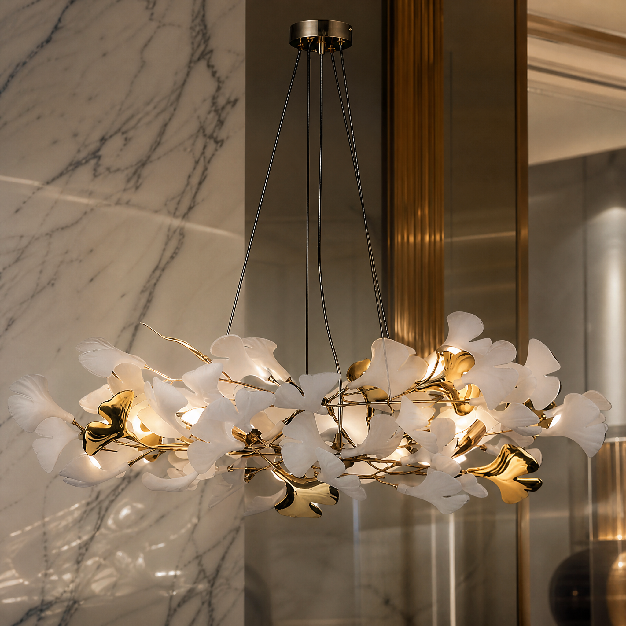 A detailed close-up shot of the VORELLI Prano Circular Chandelier II, highlighting the intricate sculptural composition of its flowing botanical forms and premium finishes.