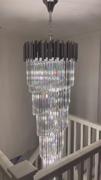 Boeotia spiral staircase chandelier with cascading diamond cut crystal drops creating a dramatic luxury centrepiece