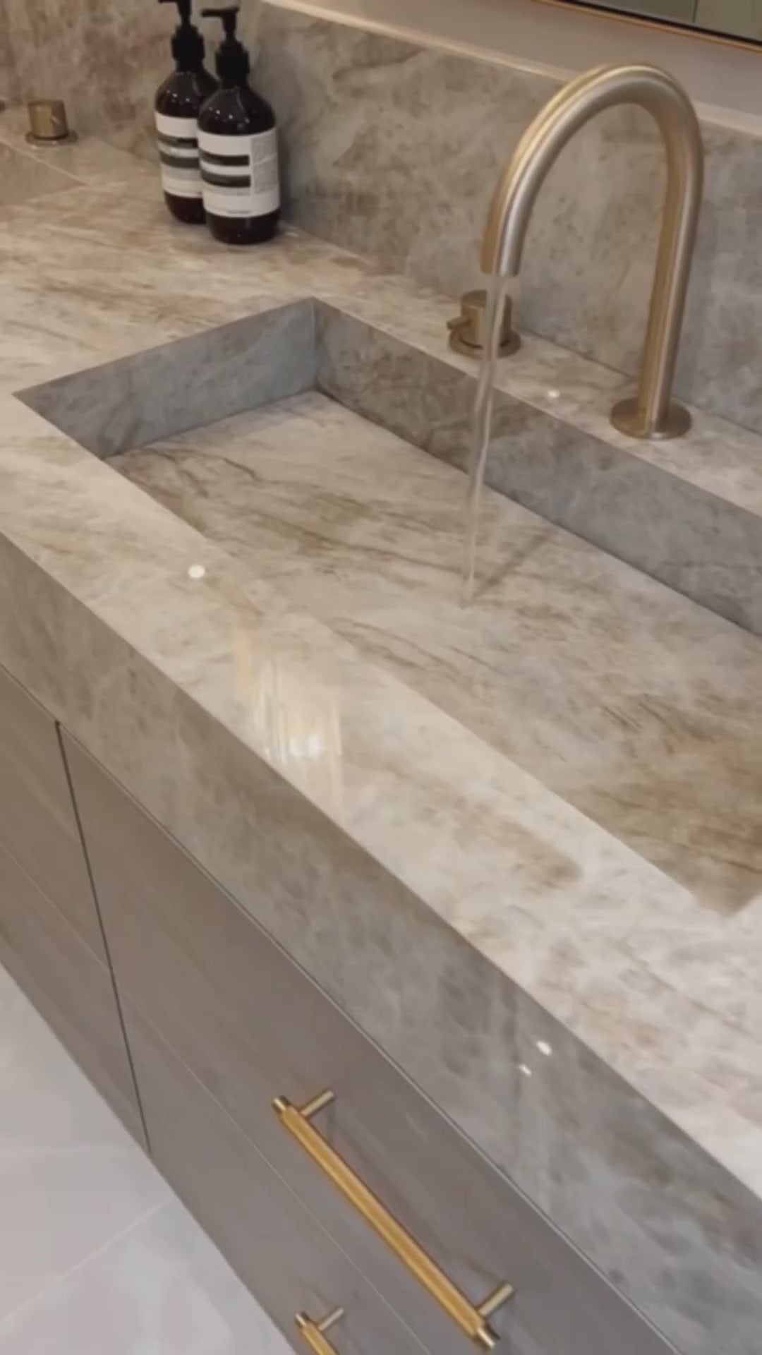 VORELLI Belair wall light in a luxury en-suite bathroom, delivering soft atmospheric lighting for refined daily rituals