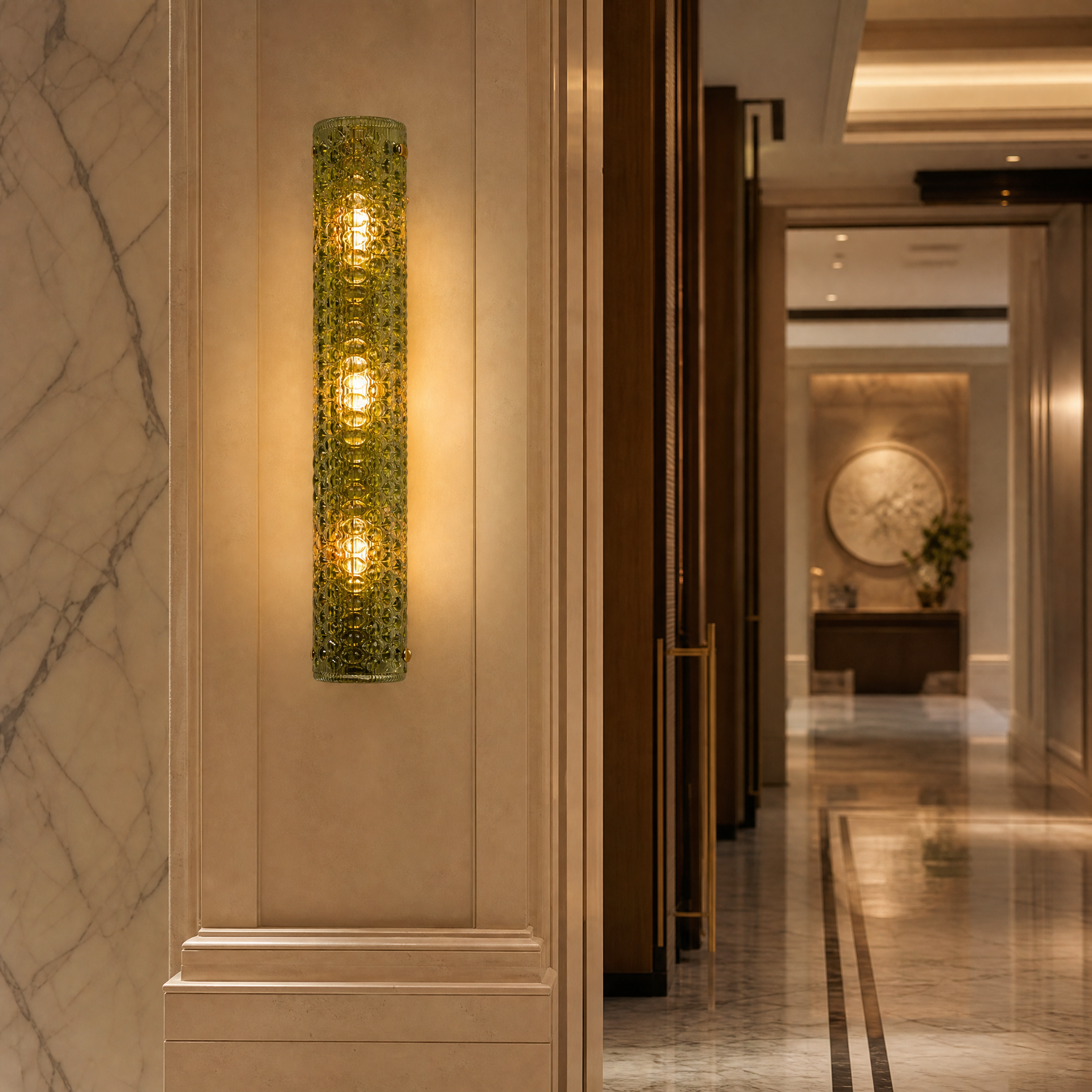 An elegant row of Rapino elongated wall sconces casting a warm ambient glow along a luxury hospitality hotel corridor.