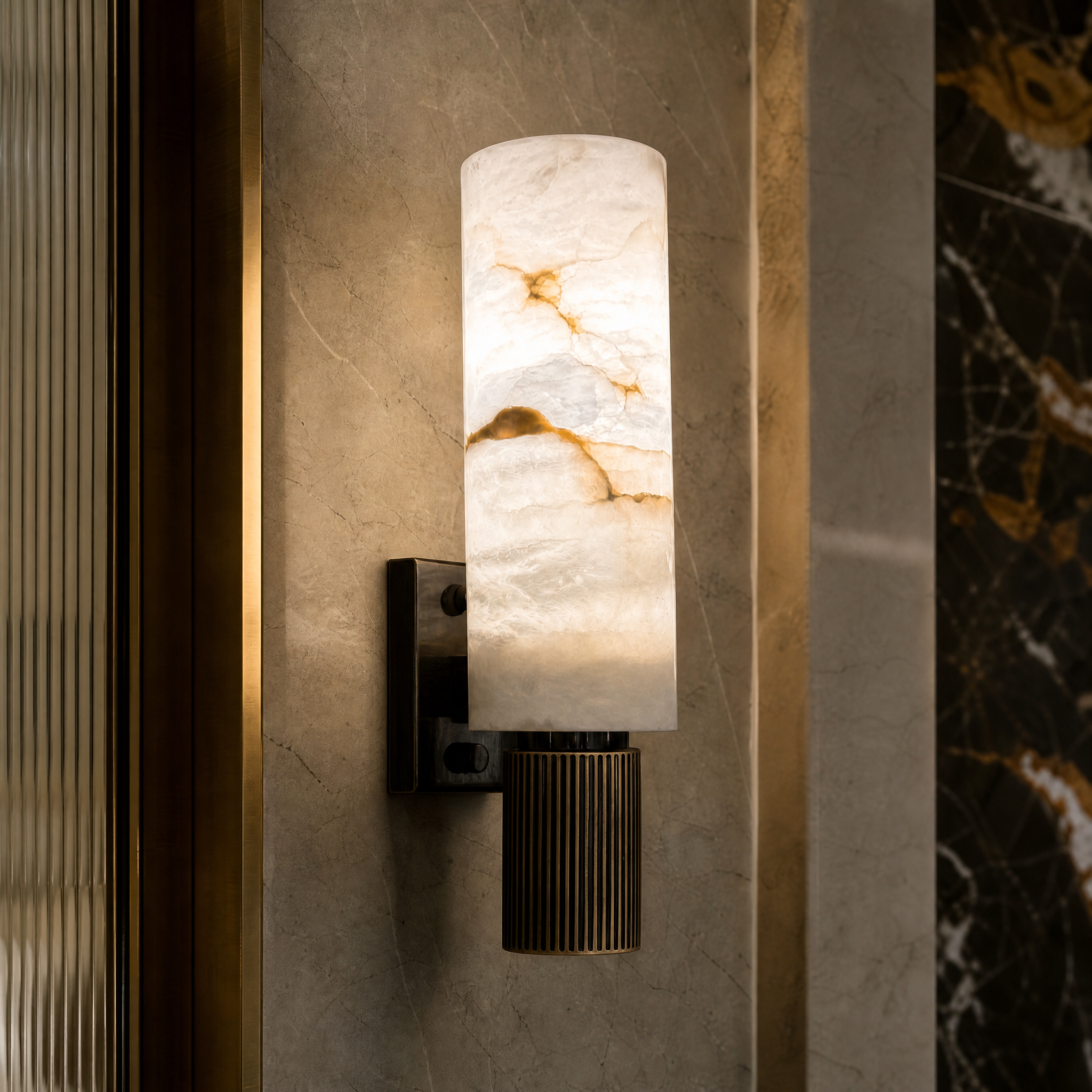 Macro closeup shot of the Riviera Marble Wall Light highlighting the refined veined marble texture and premium fluted metal base details.