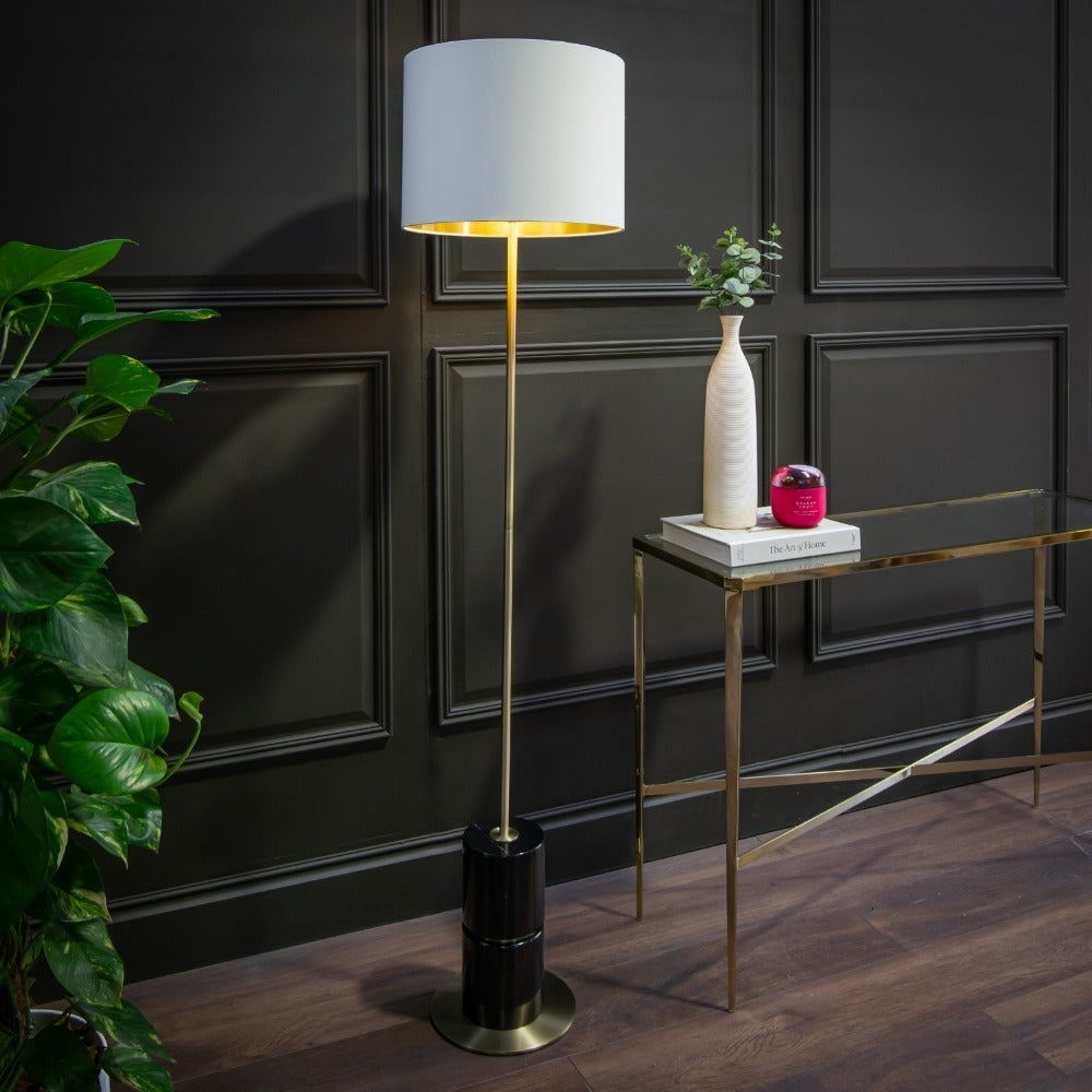 Robyn black marble floor lamp featuring slim vertical stem and fabric shade installed in contemporary interior