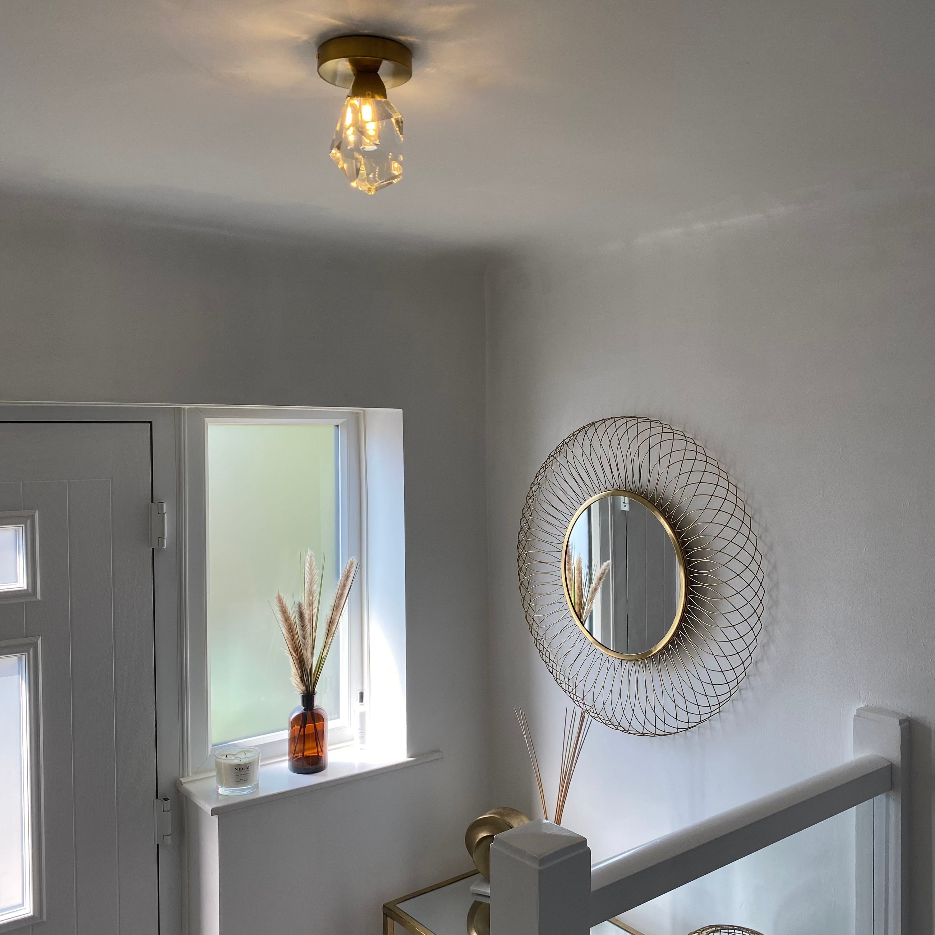 Runtz modern diamond cut crystal ceiling light installed in hallway creating refined ambient glow