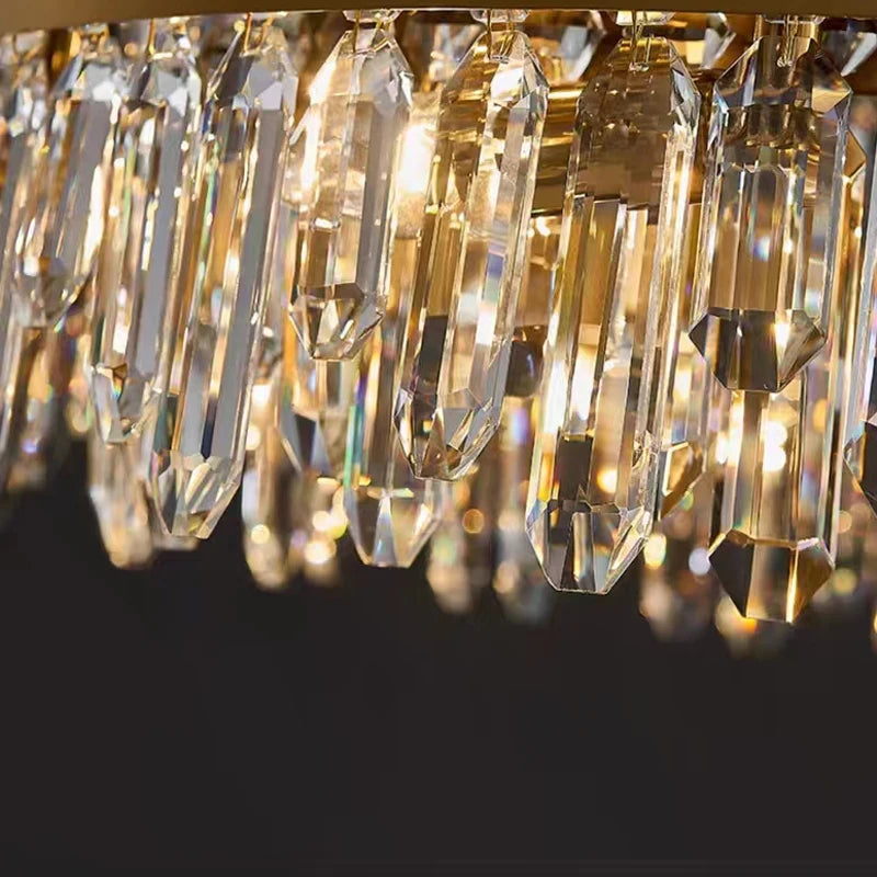 Close up of structured frame band and diamond cut oblong crystals on Sagres wall light