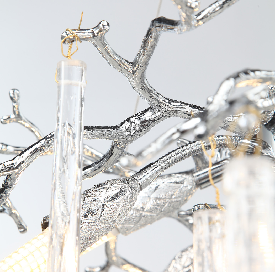 Side profile view of the Farella circular chandelier by VORELLI, emphasizing its modern luxury aesthetic and dynamic movement.