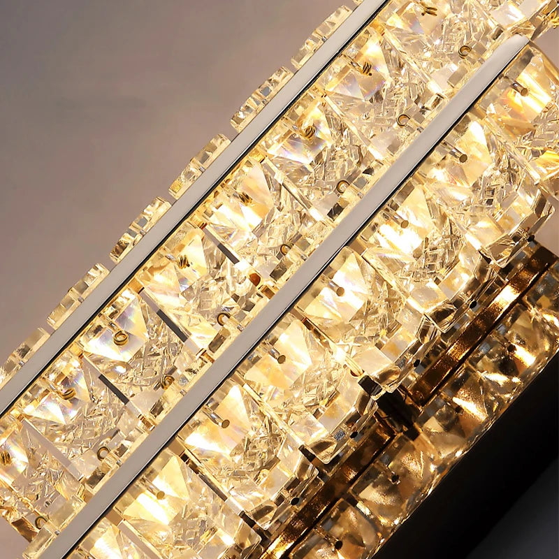 Close up of diamond cut crystal elements forming the vertical structure of Signature I wall light