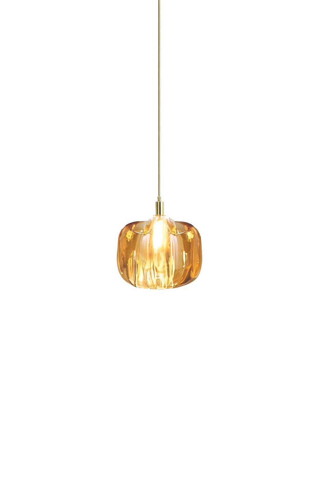 Sophisticated amber tinted Emiliano crystal globe pendant by VORELLI radiating an ambient luxury glow in a high-end interior setting.