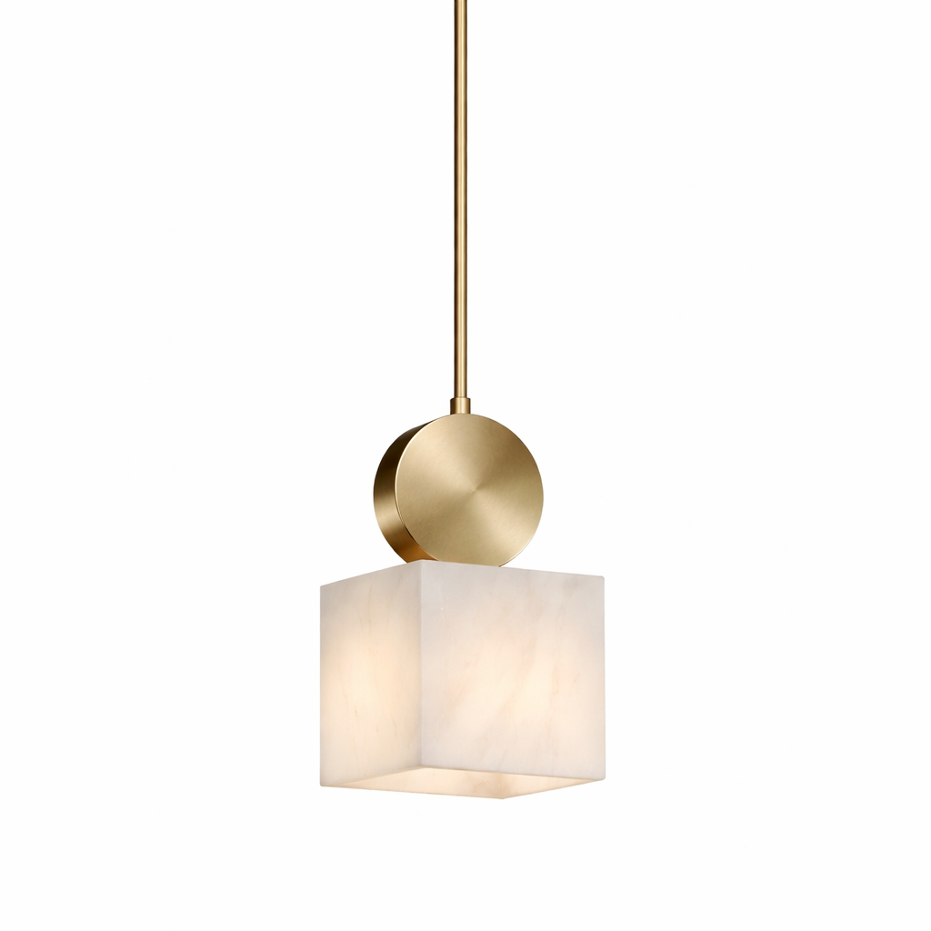 Sophisticated mood lighting featuring the Hera marble pendant light by VORELLI, showcasing its geometric cube design and elegant gold finish in a contemporary setting.